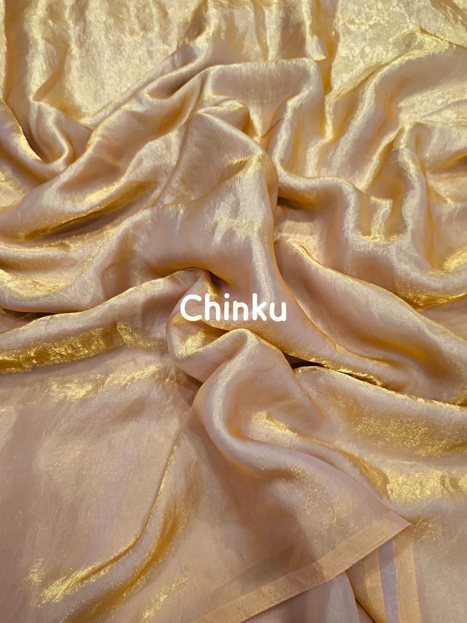 Gold fabric with 'Chinku' branding