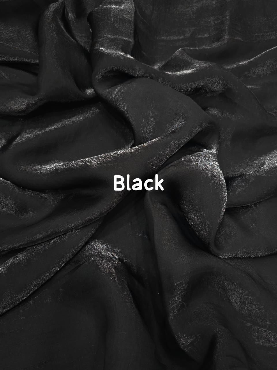 Close-up of black fabric with the word 'Black' displayed.