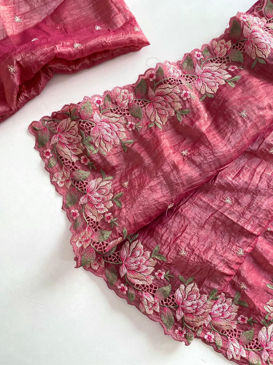 Pink fabric with floral embroidery