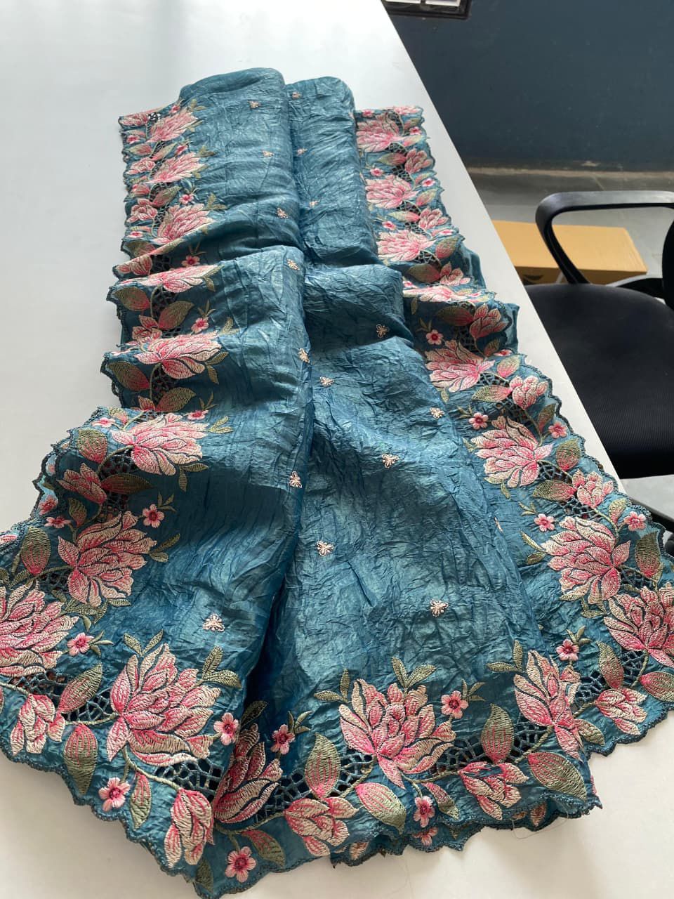 Blue embroidered fabric with floral patterns 