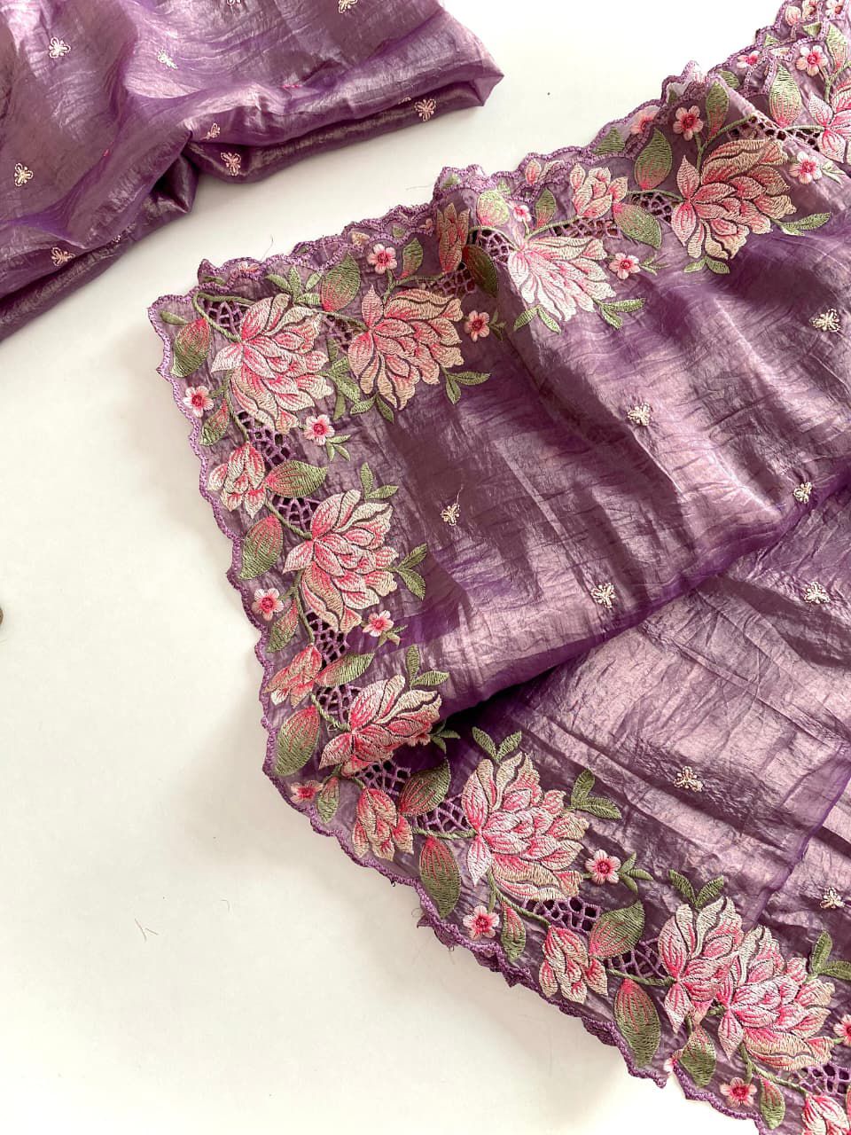 Purple fabric with floral embroidery