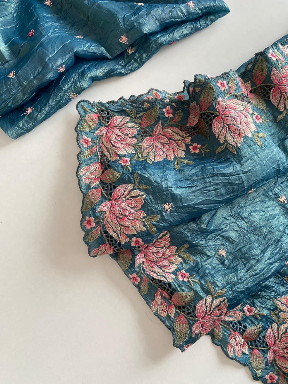 Blue fabric with floral embroidery