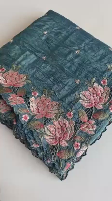 blue fabric with floral embroidery