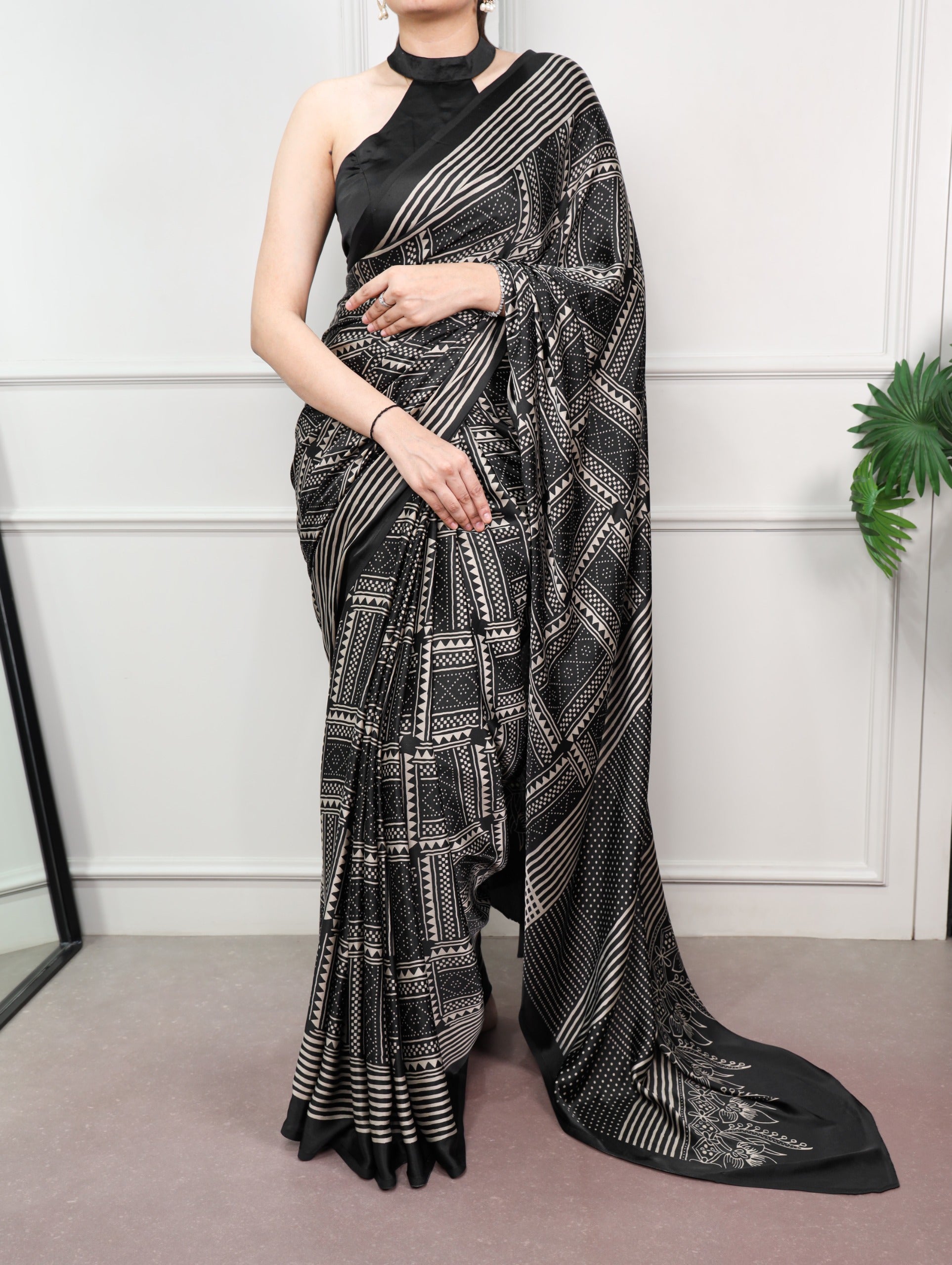 black saree with floral patterns 