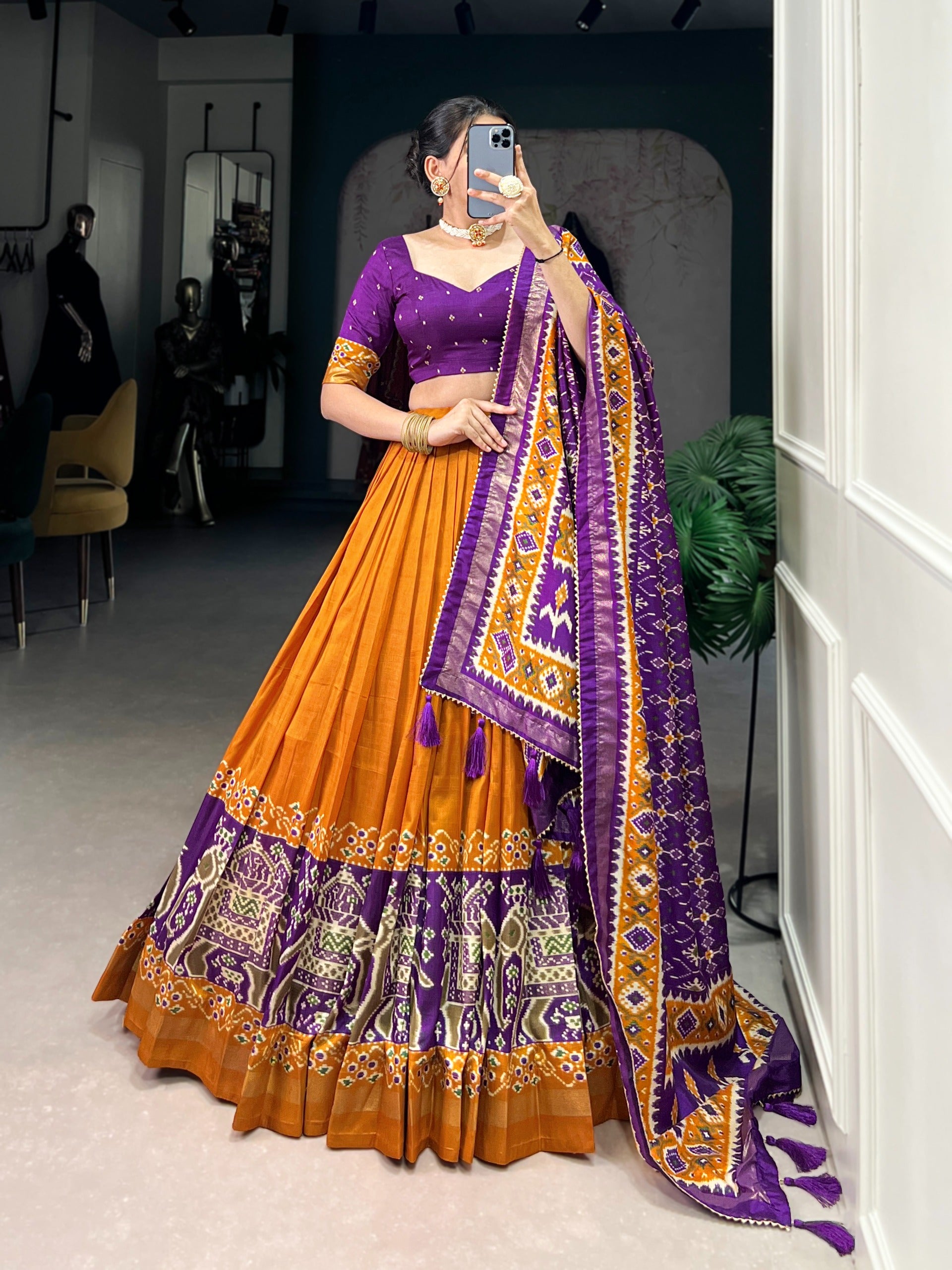 traditional orange lehanga with floral patterns 
