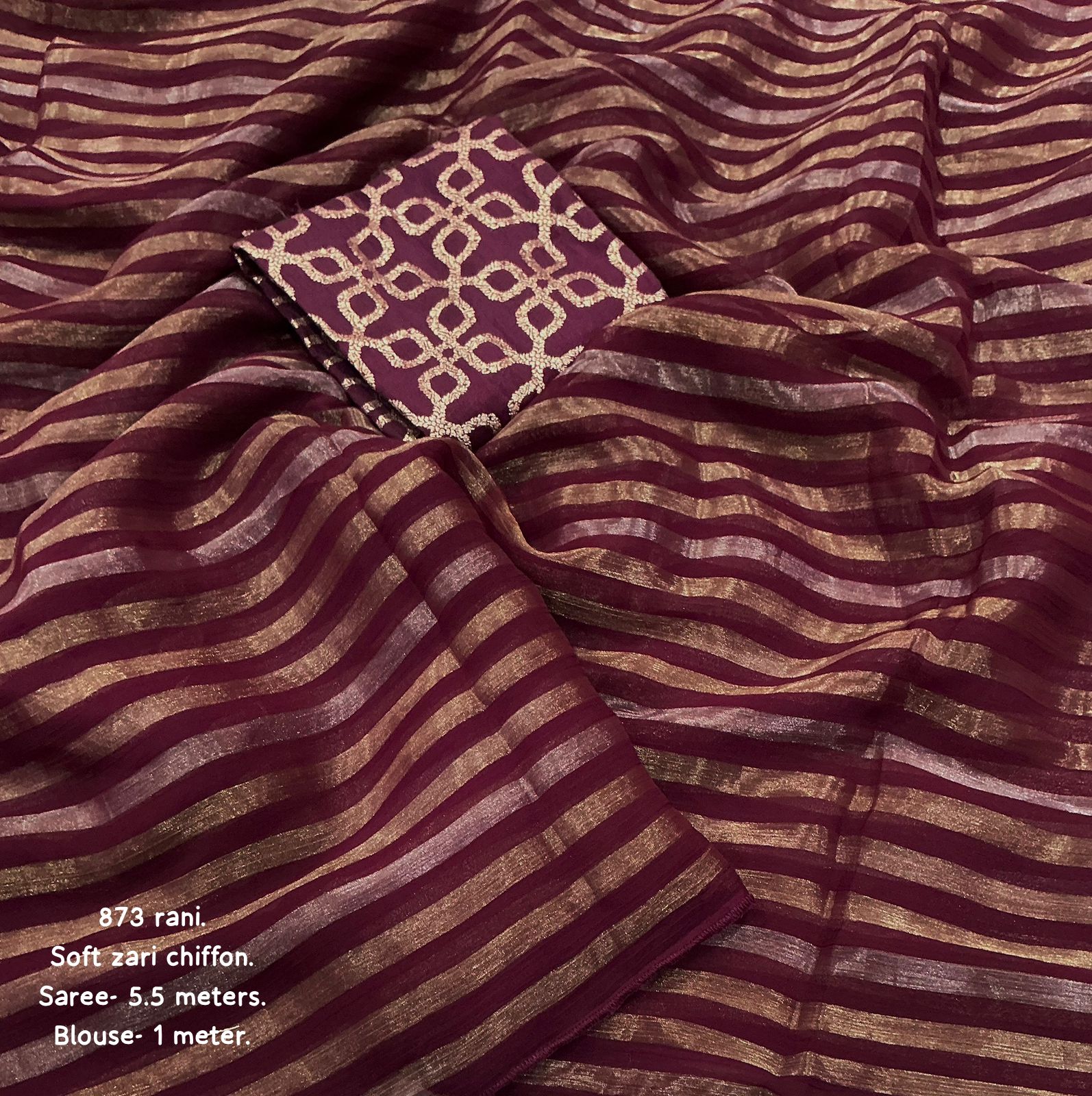 Wine striped fabric with a patterned square in the center.