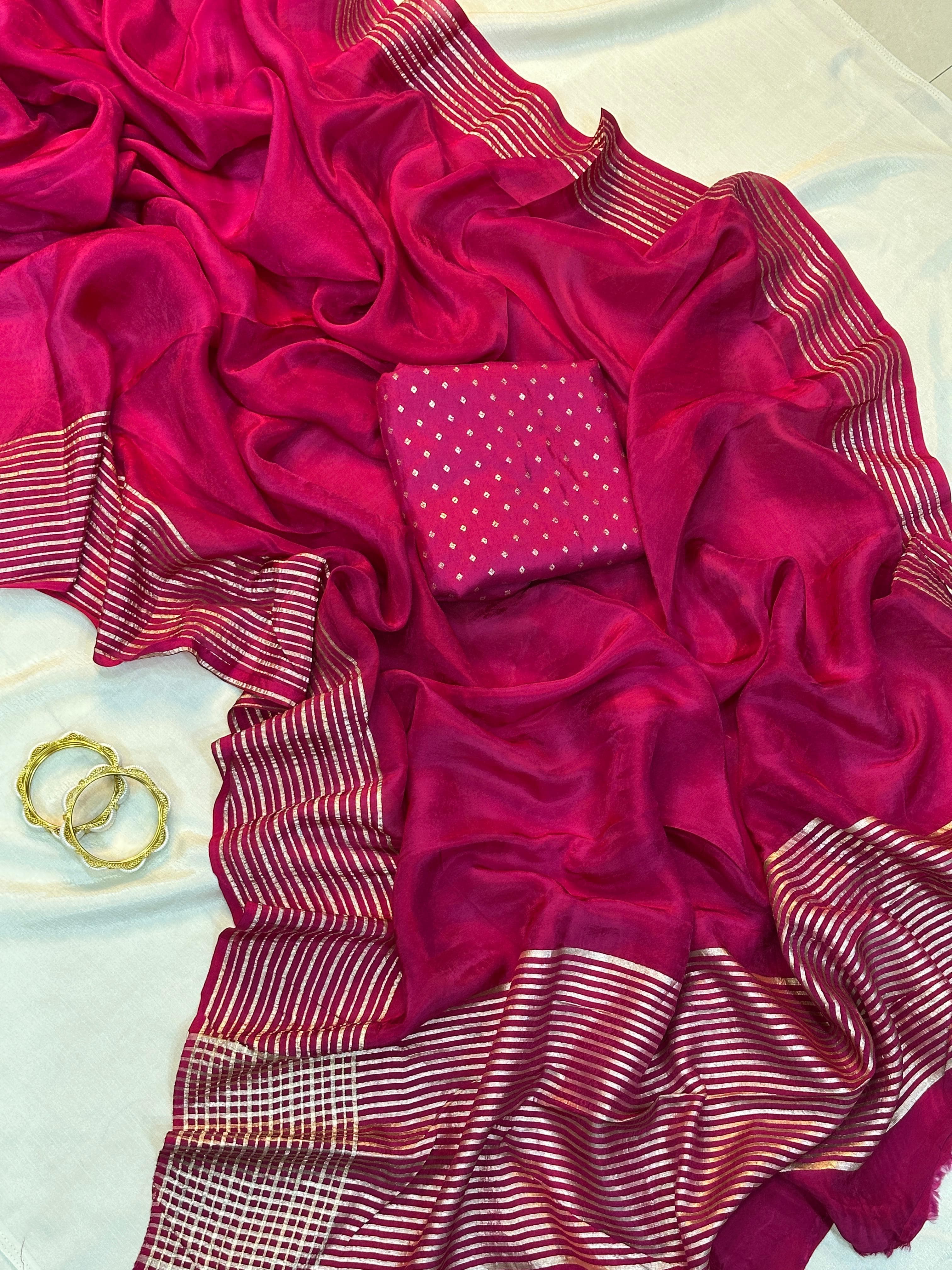 Pink fabric with ruffled edges on a white background