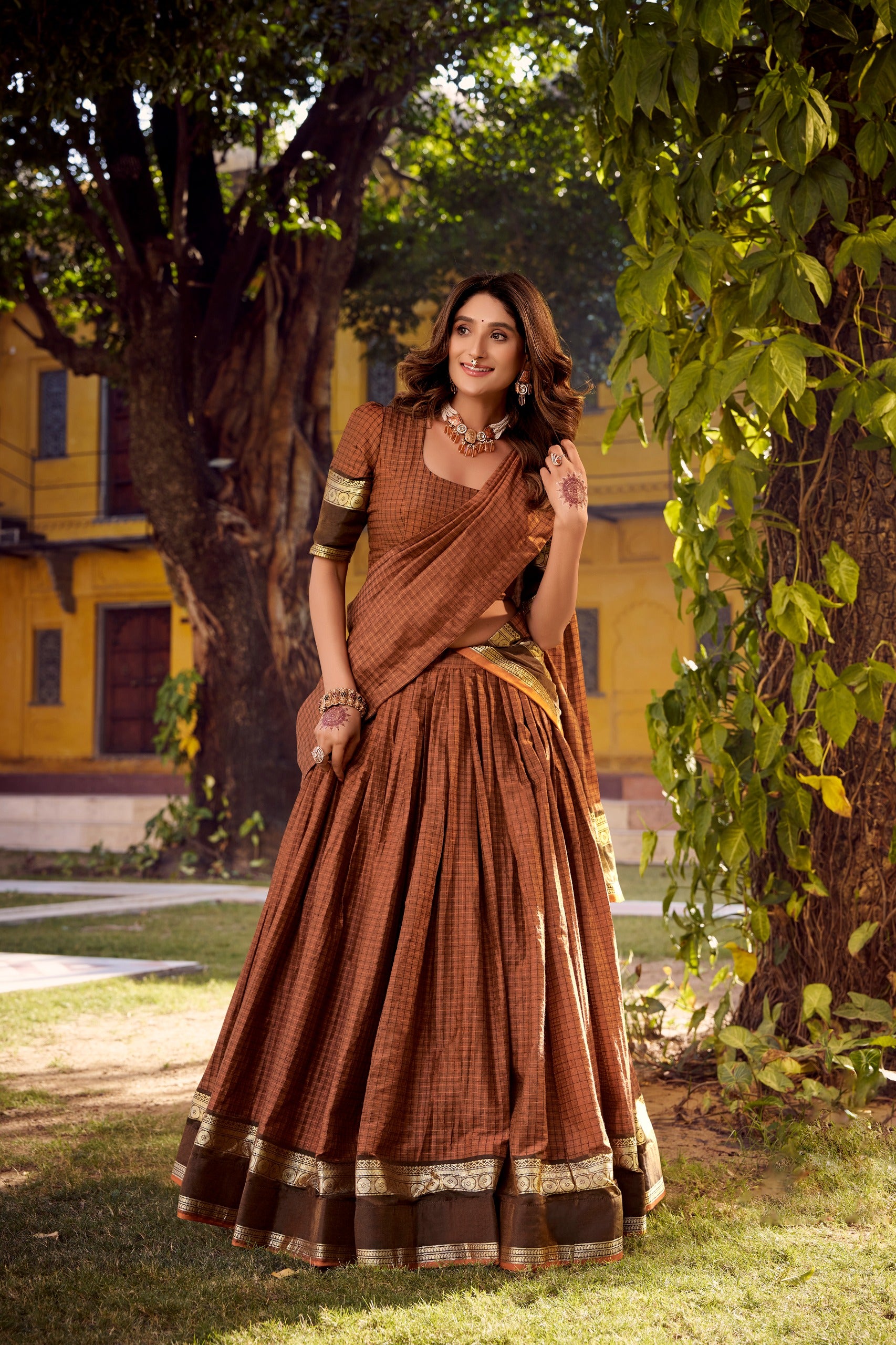 Traditional Rust Orange lehanga with gold border 