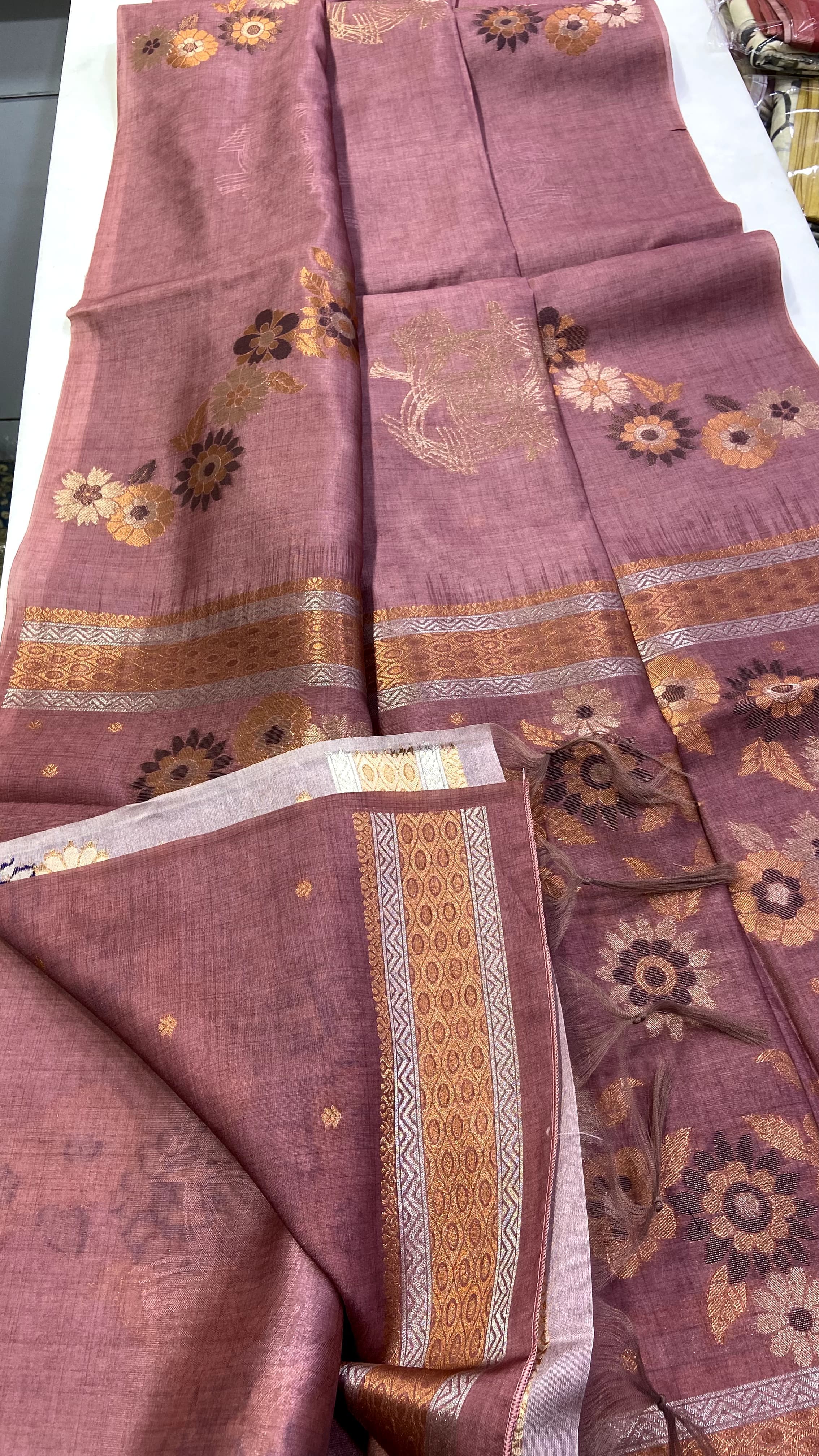 Copper fabric with floral patterns on a white background