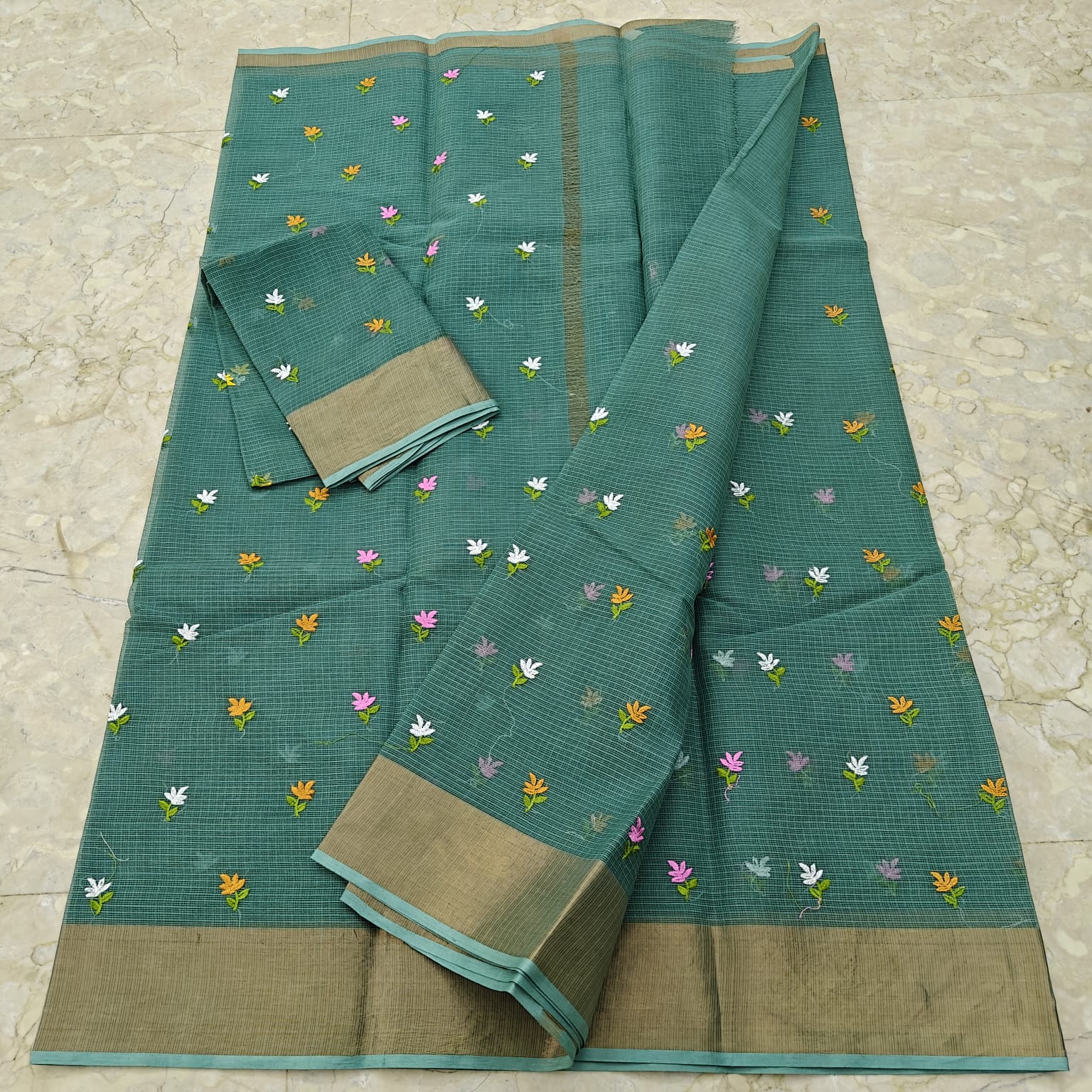Rama Green saree with floral patterns