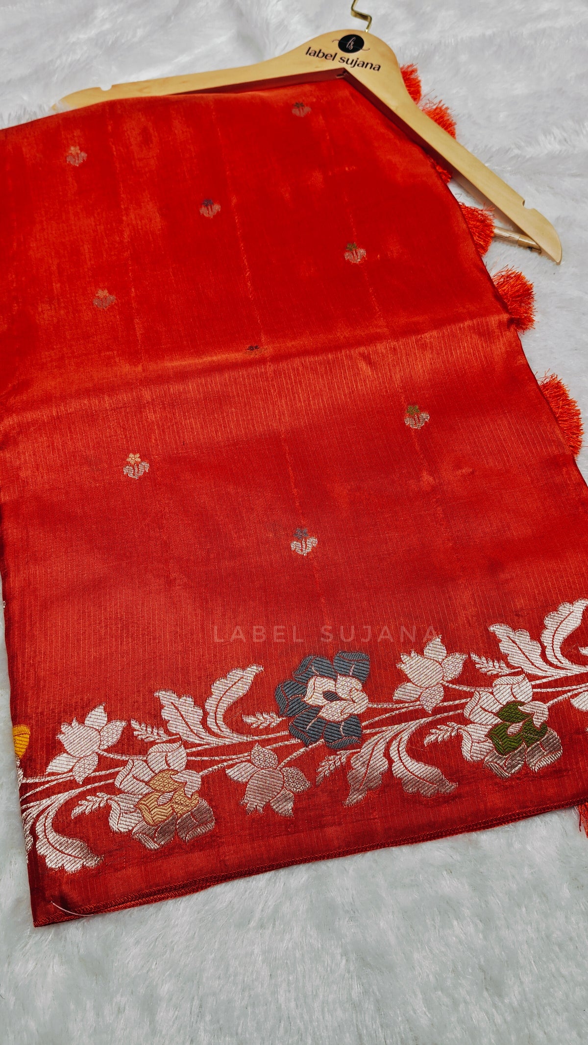 A Rust orange silk saree