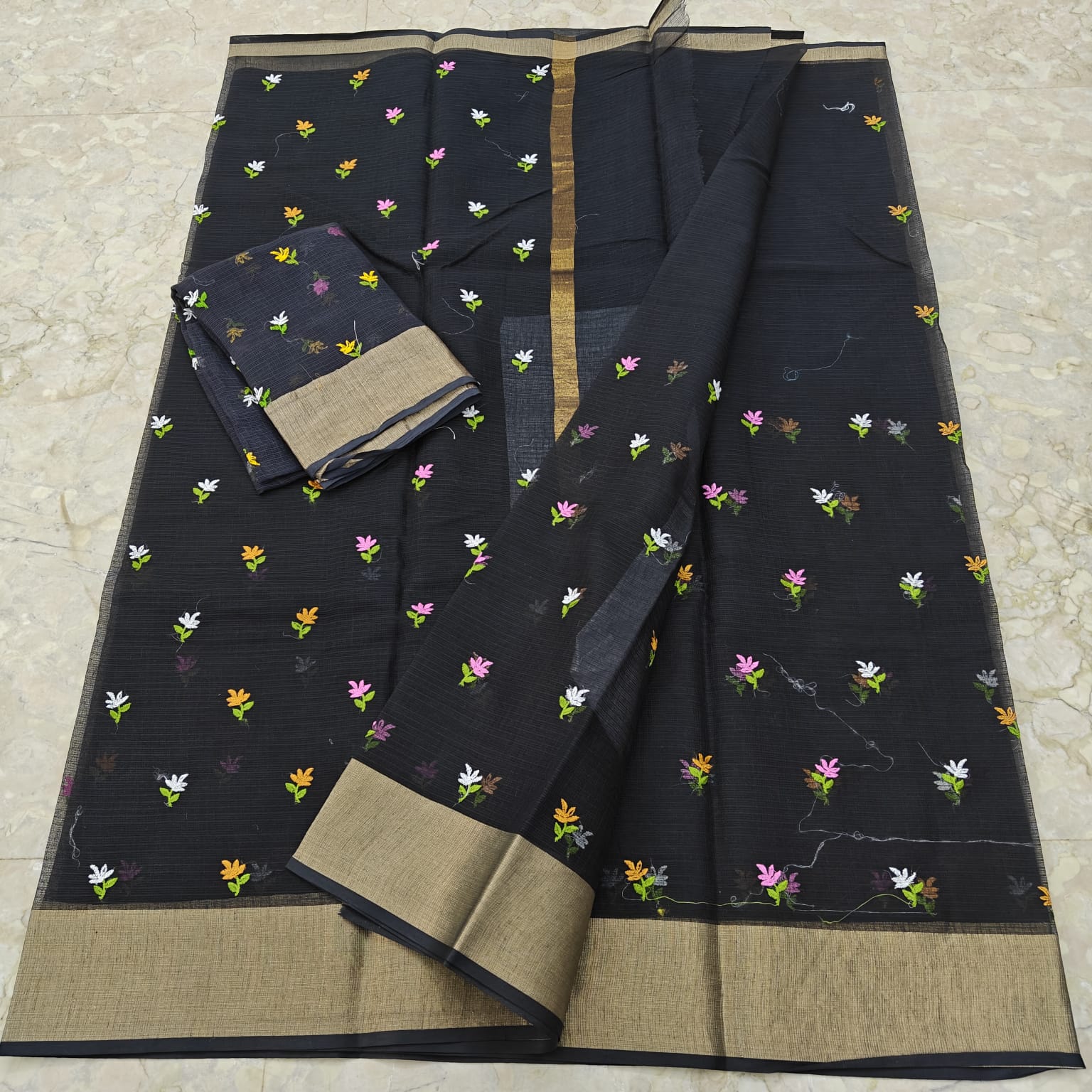 Black saree with floral patterns 
