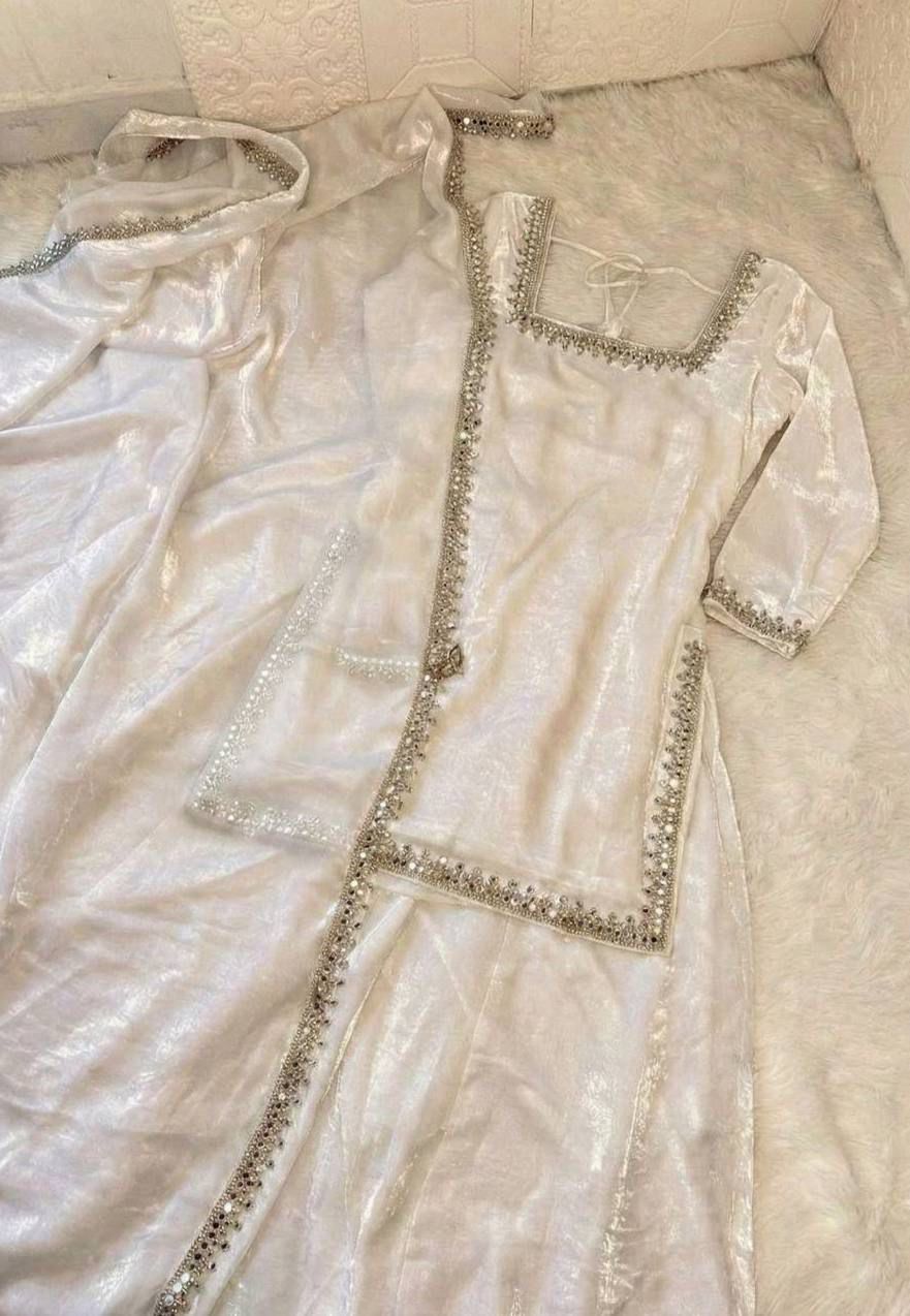 White embroiderey traditional outfit on a light background