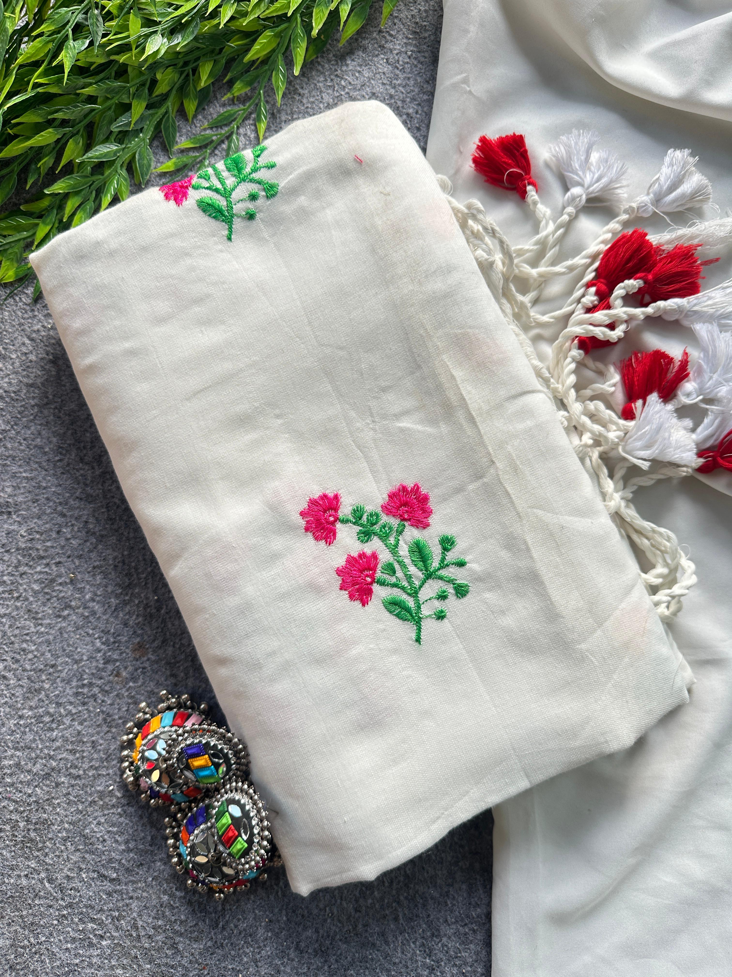 White fabric with floral embroidery patterns 