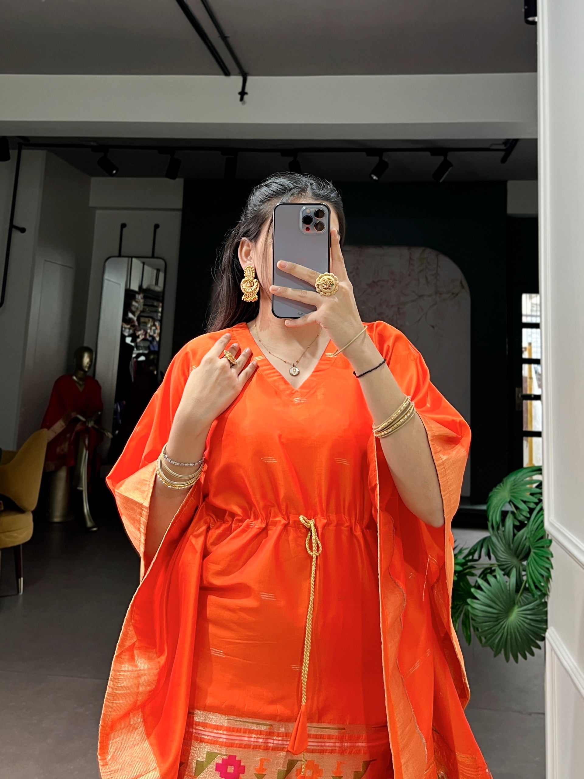 orange traditional outfit with gold accents