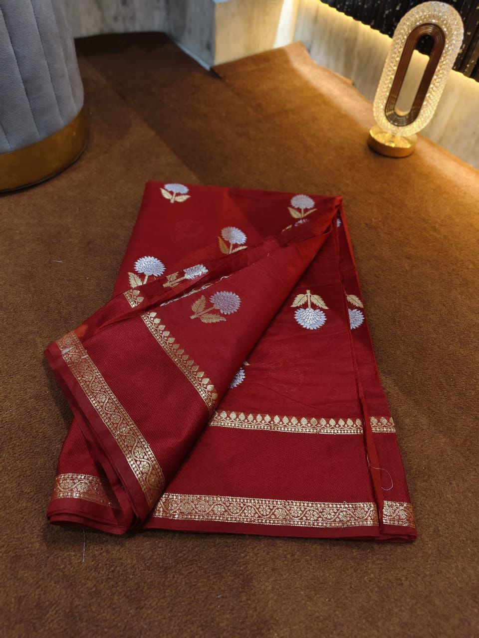 Maroon saree with floral patterns