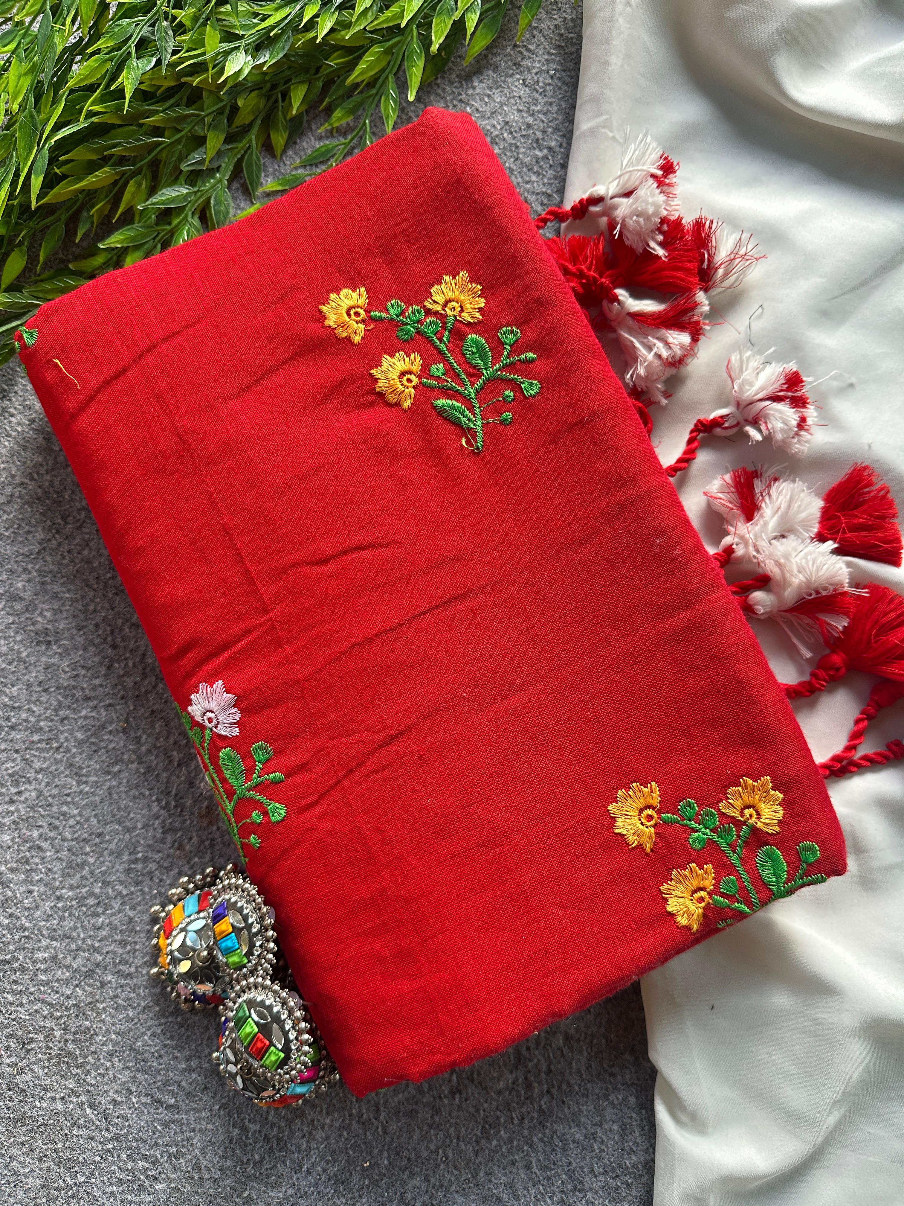 Red fabric with floral embroidery patterns 