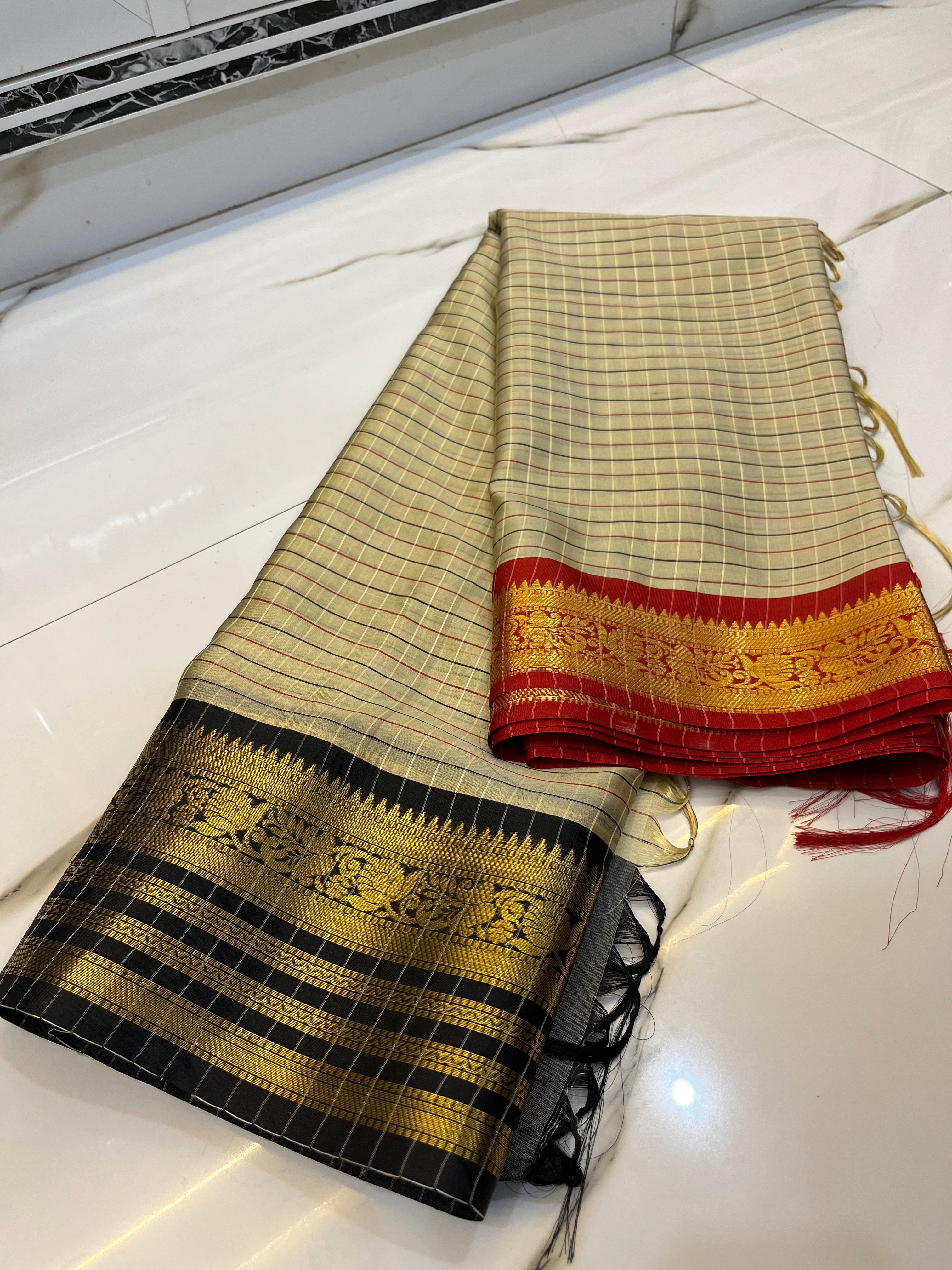 Traditional Gray saree with black, gold, and red patterns