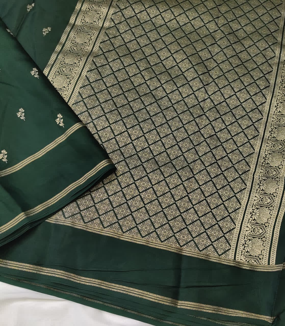 Dark Green saree with gold border and intricate pattern 
