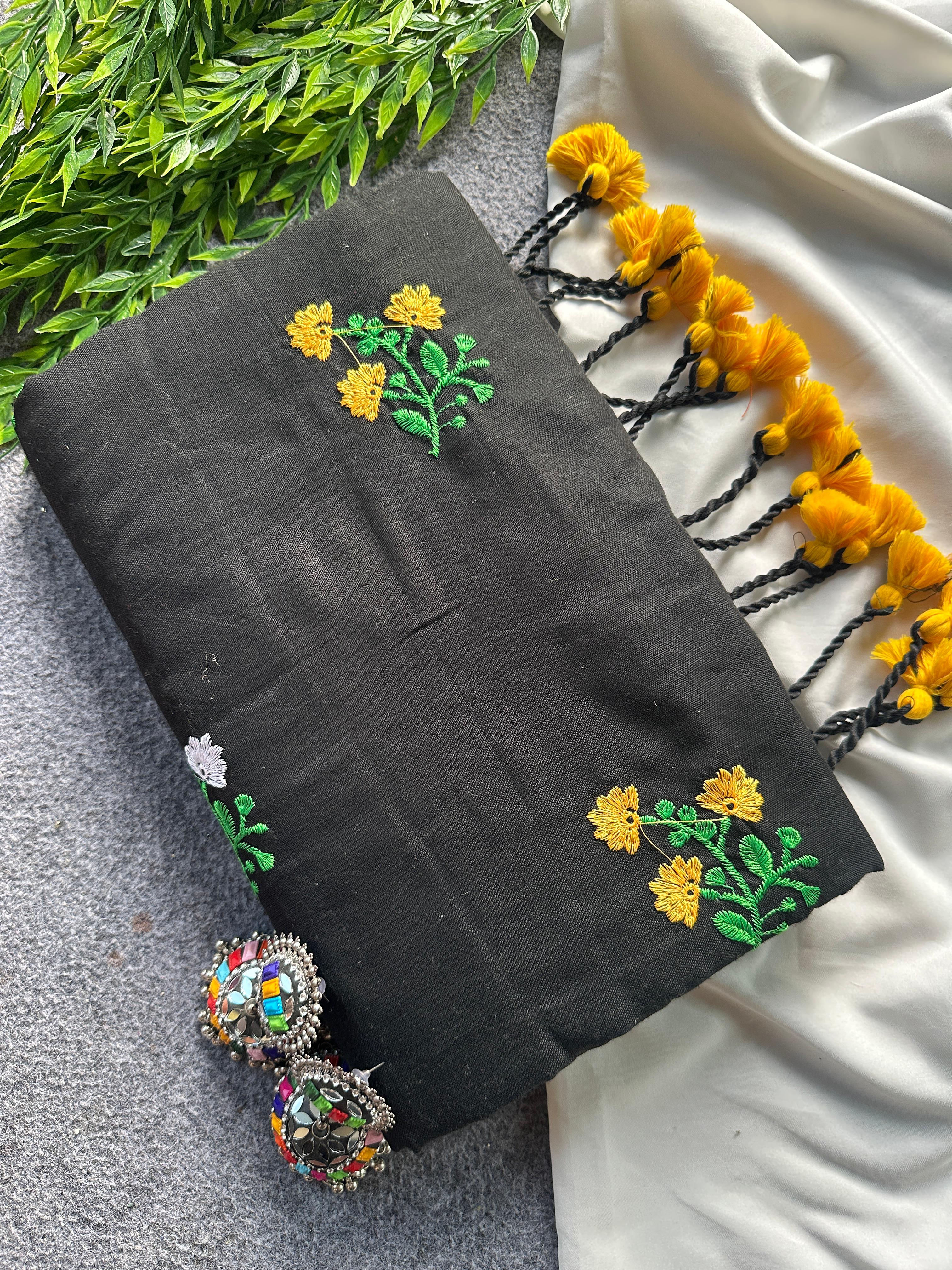 Black fabric with floral embroidery patterns 