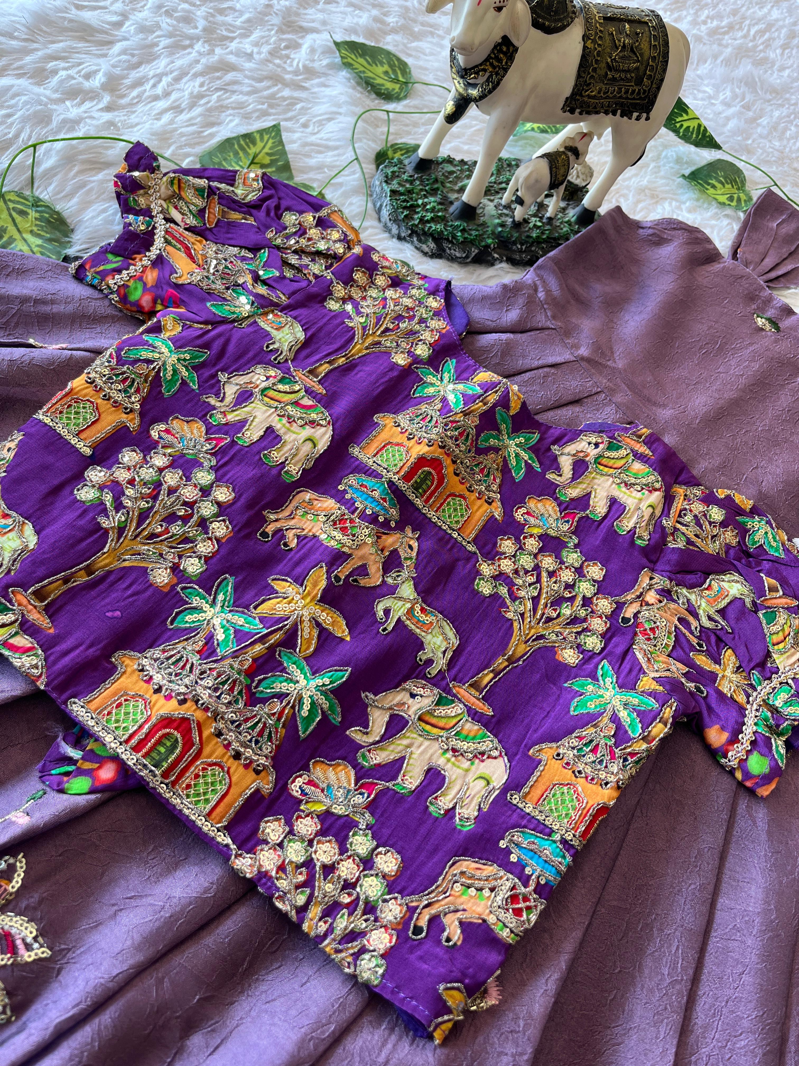 Colorful Lavender embroidered fabric with elephant patterns on a purple background