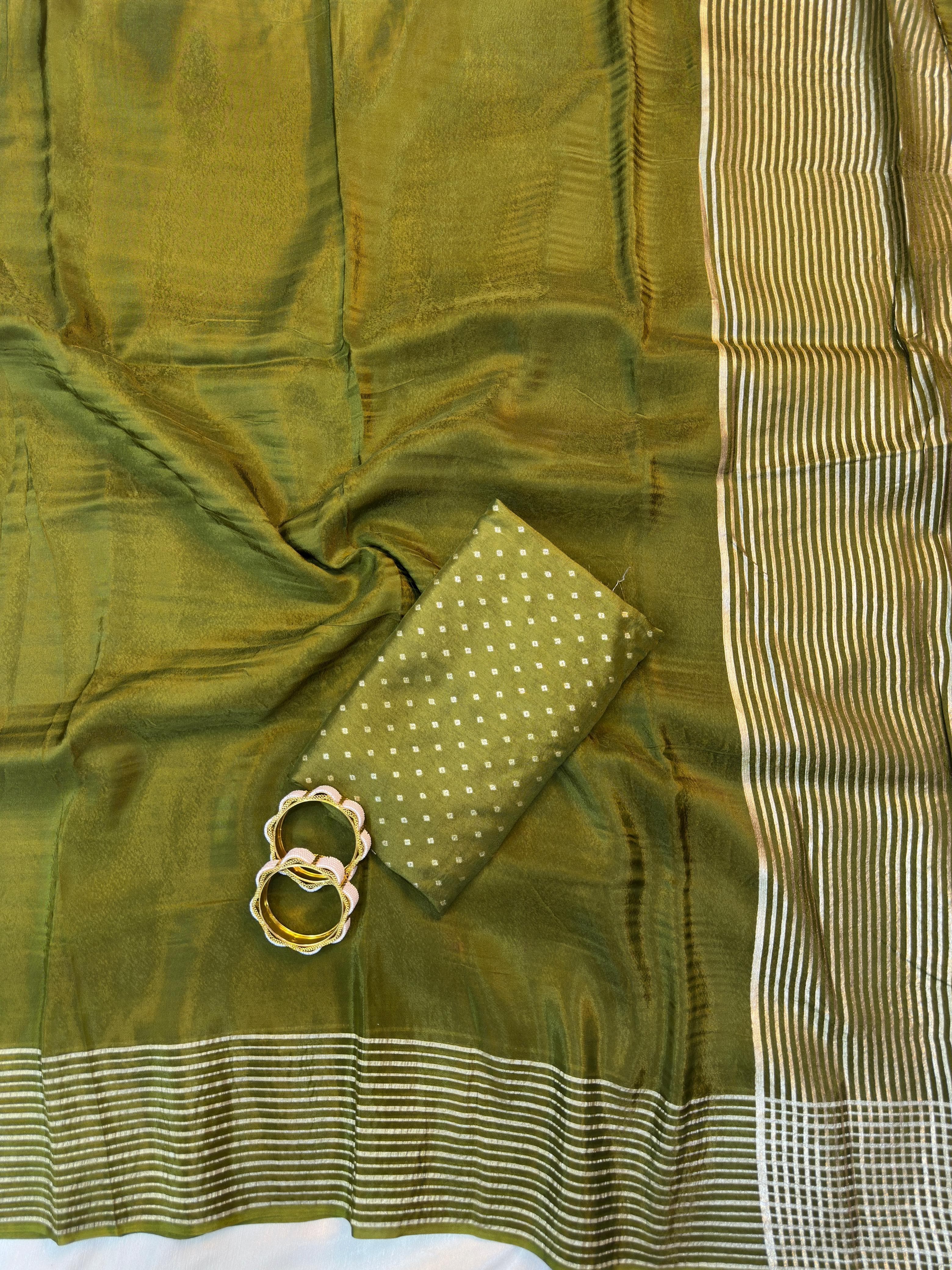Olive Green fabric with a pocket and decorative ring on a white background