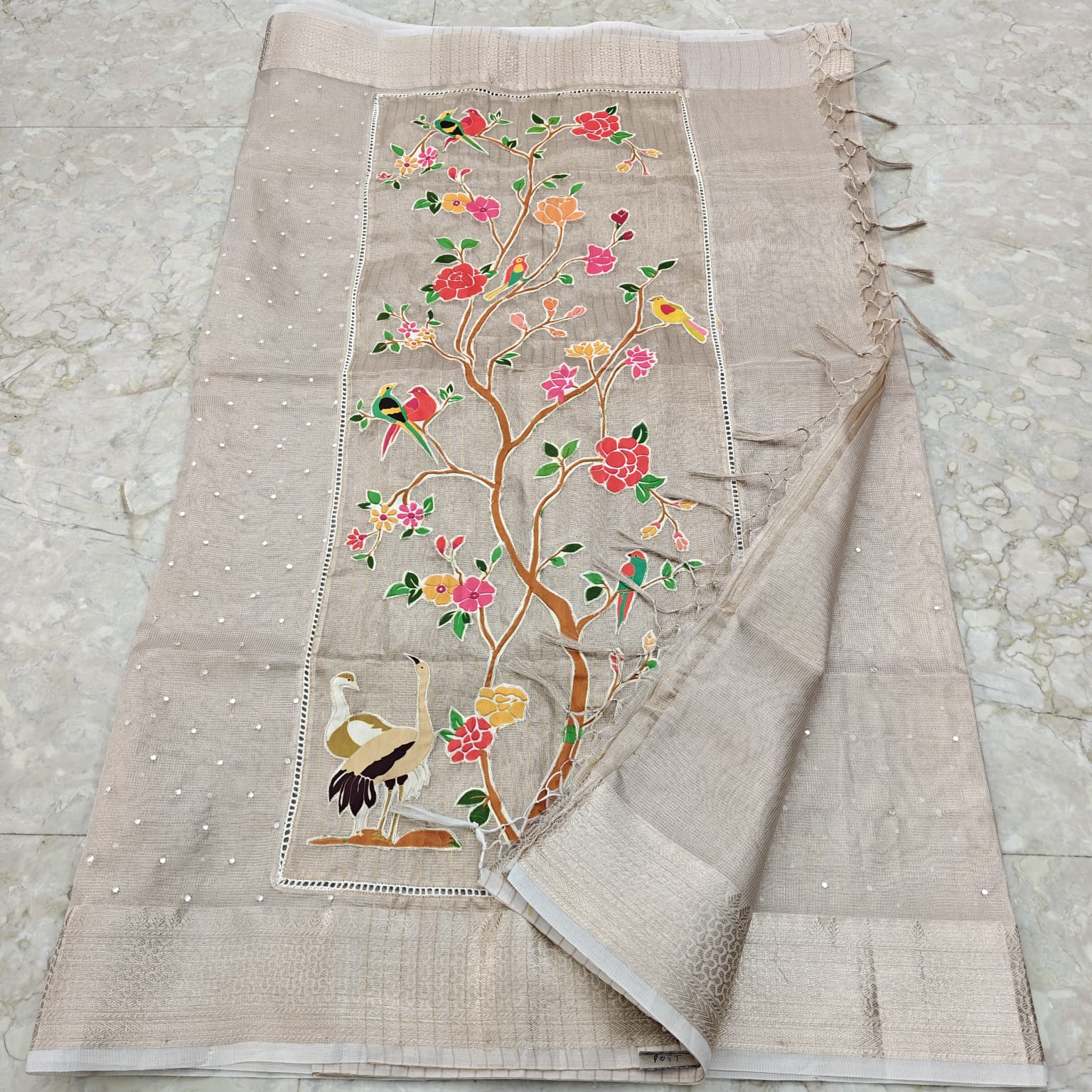 Embroidered fabric with floral and bird design on a beige 1 background