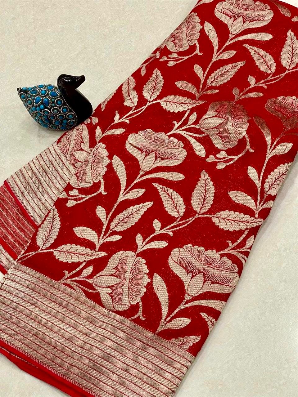 Red saree with floral pattern on a beige background