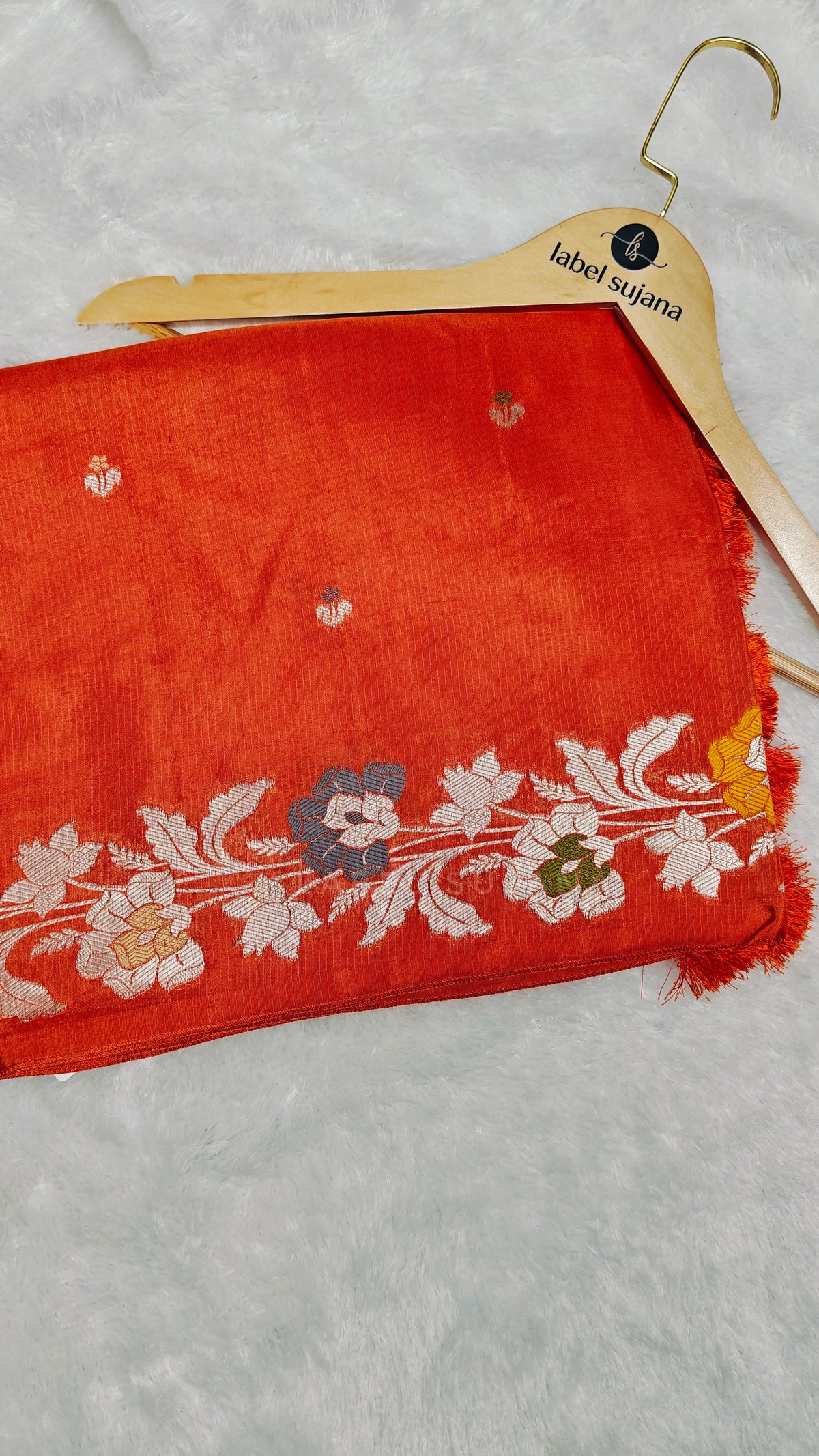 A Rust orange silk saree