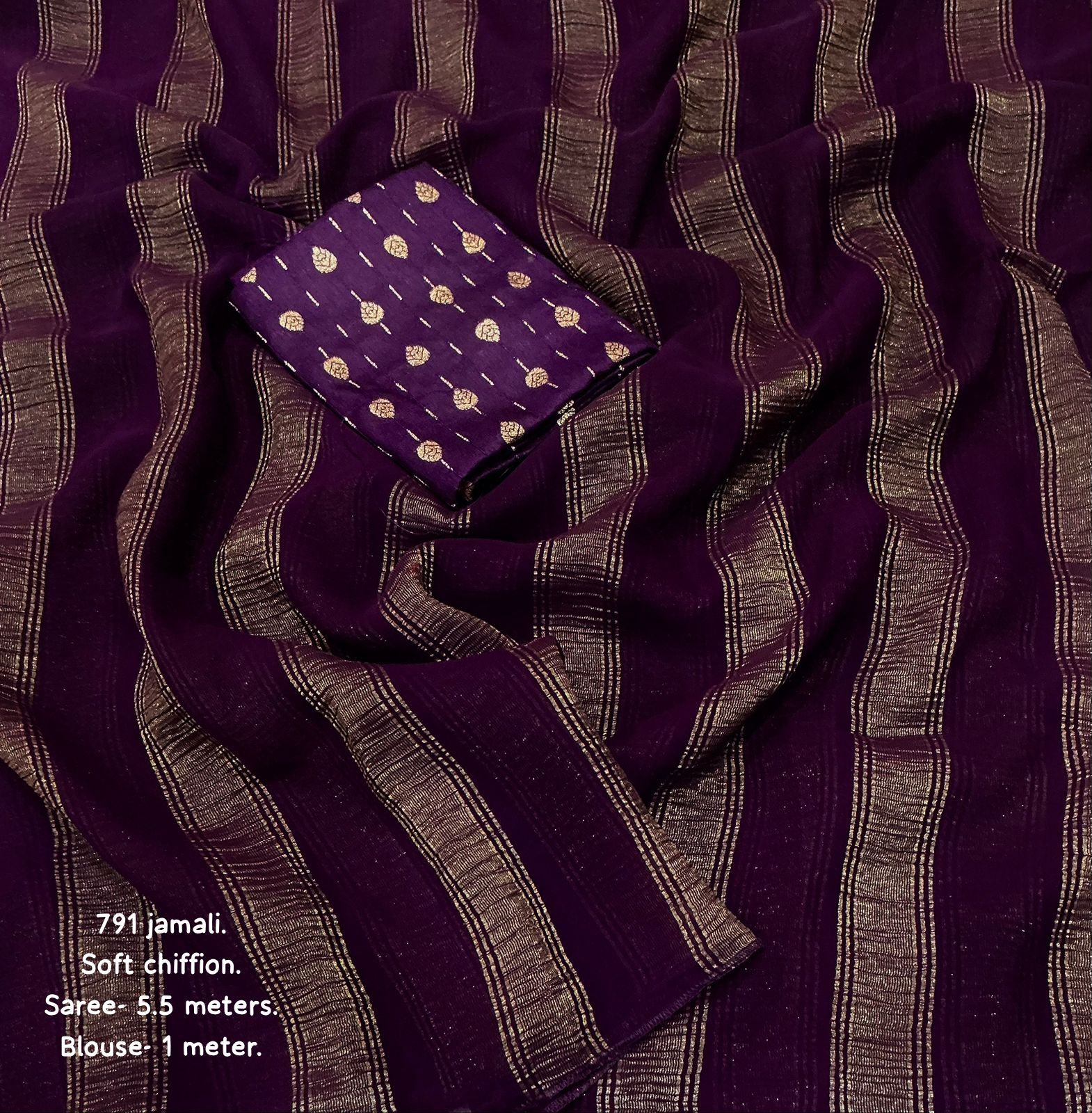 Purple fabric with gold patterns and text on a matching background