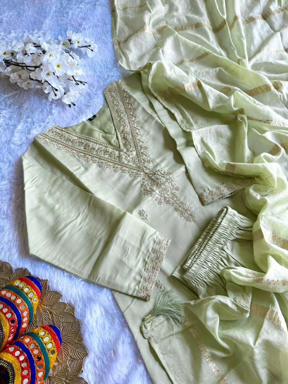 Light green fabric with embroidered work