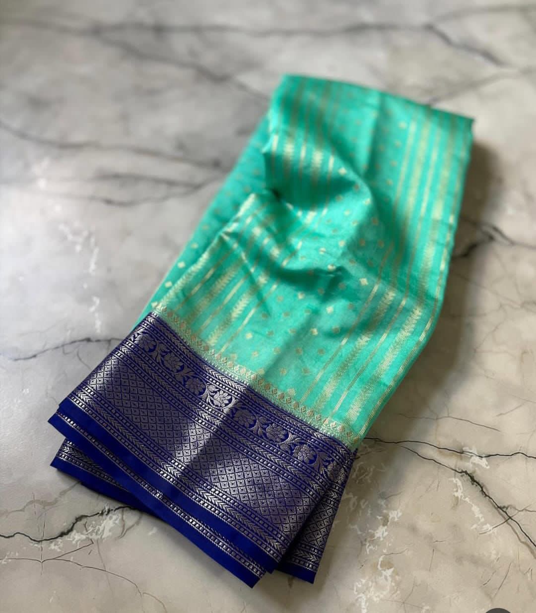 Cyan traditional fabric on a marble surface