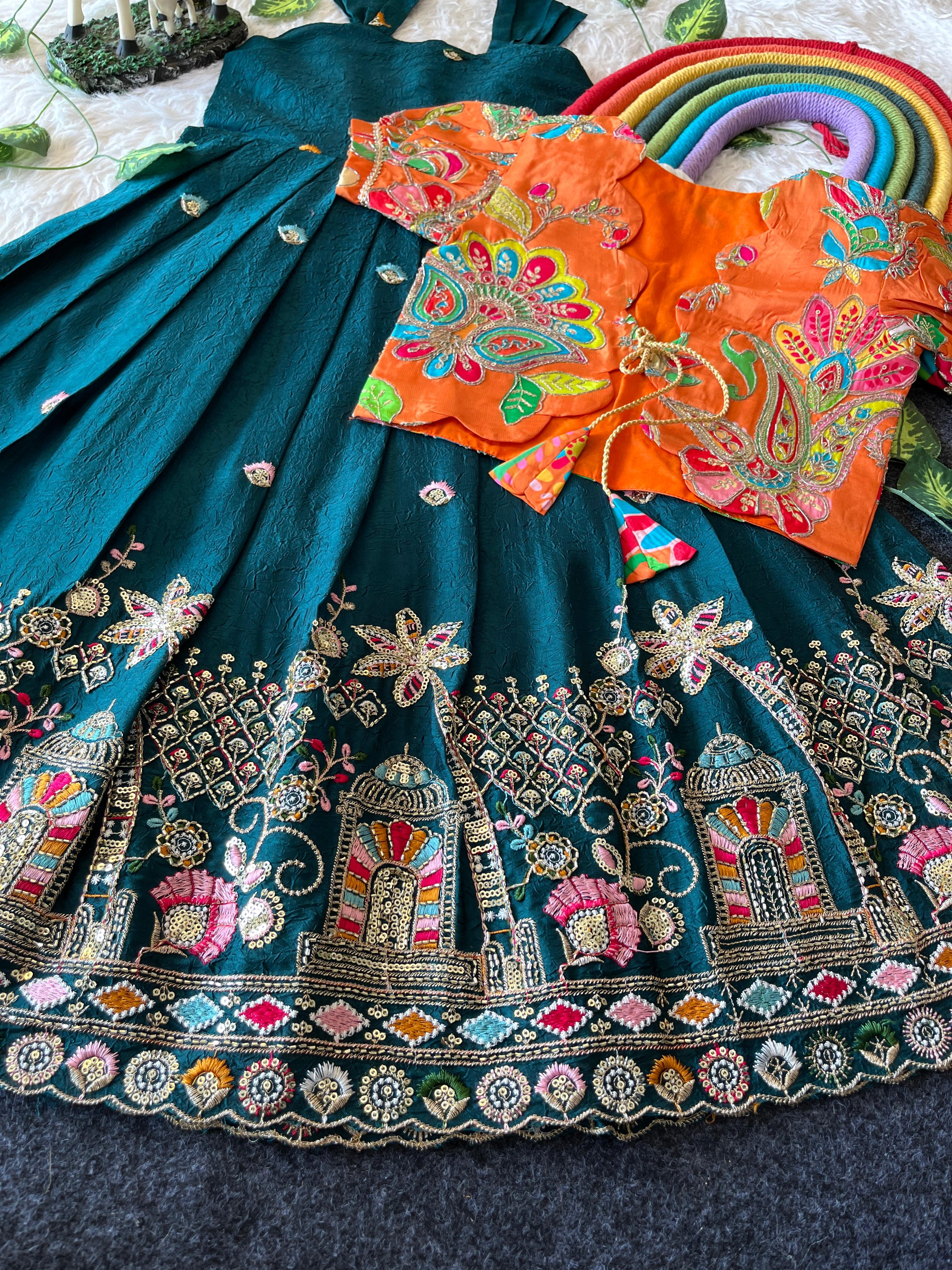 Traditional Rama green embroidered outfit with a colorful blouse on a dark fabric background