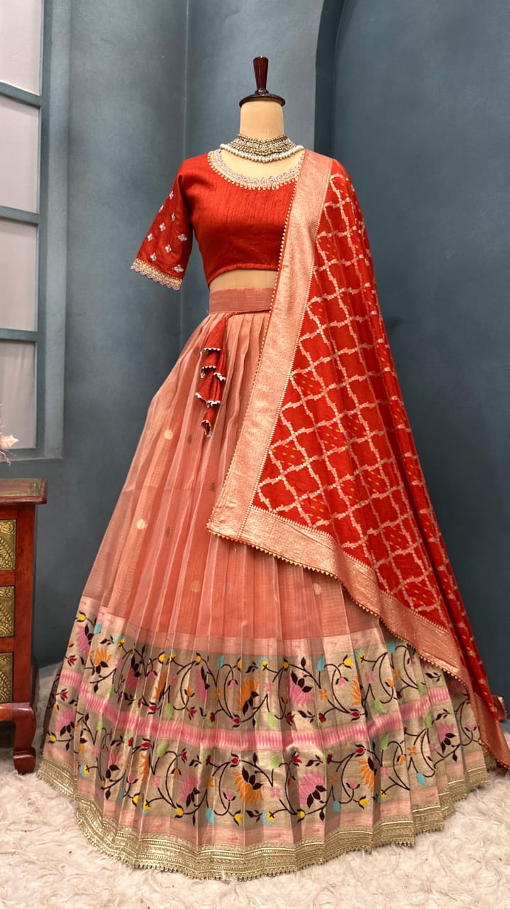 Light orange lehenga on a mannequin against a gray wall.