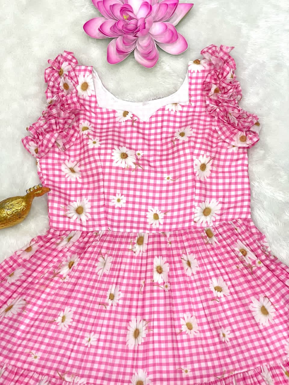 Baby Pink gingham dress with floral patterns on a white background