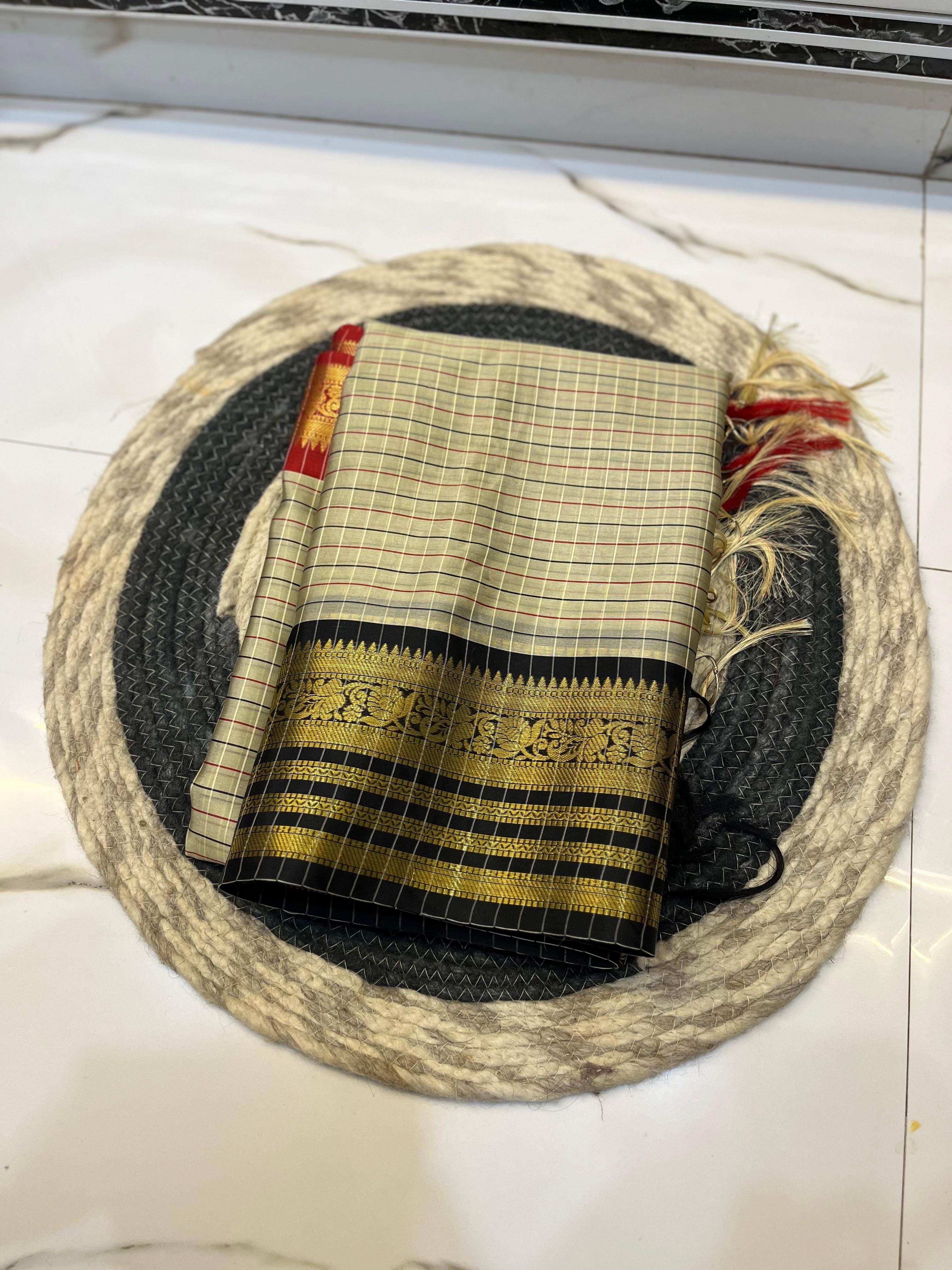 Traditional gray woven fabric with gold and black,red patterns 