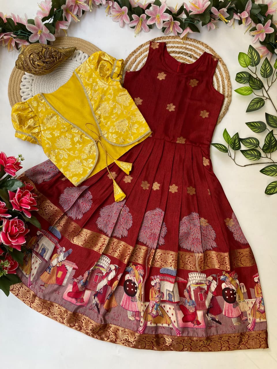 Maroon traditional dress with  jacket on a decorative background with flowers and leaves.