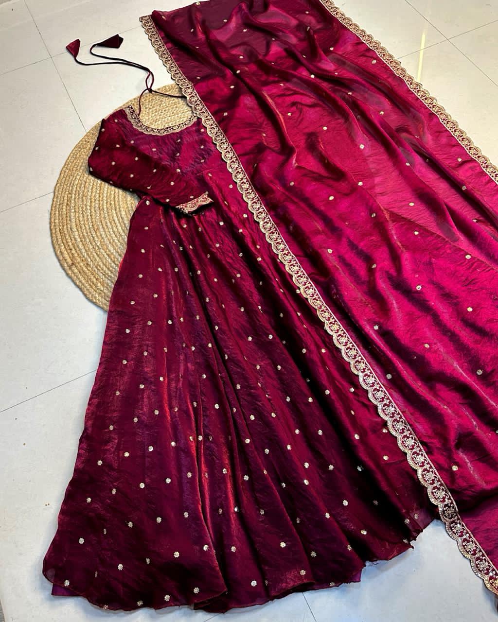 Wine dress with gold border on a light background
