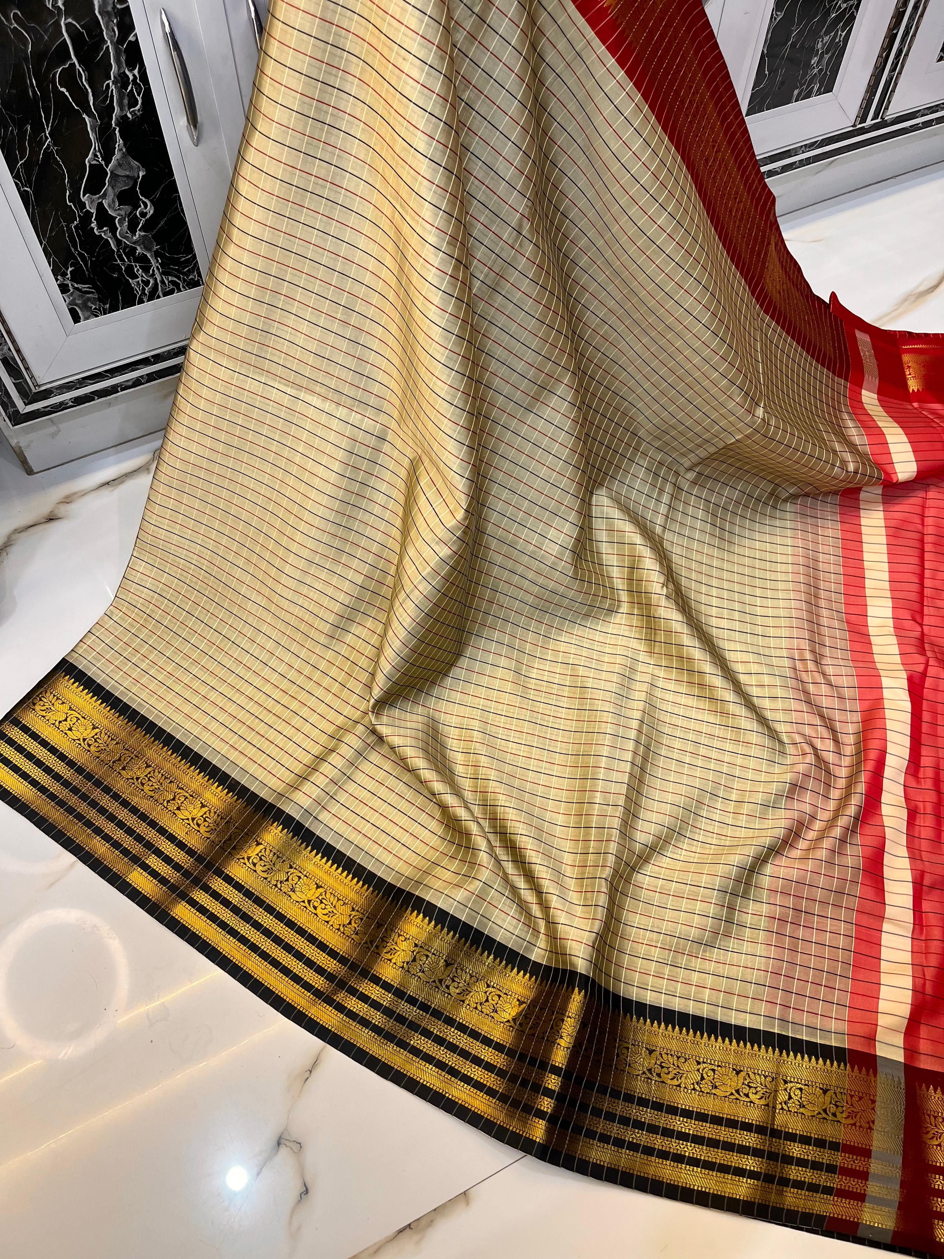 Gray Saree with gold and red and black patterns