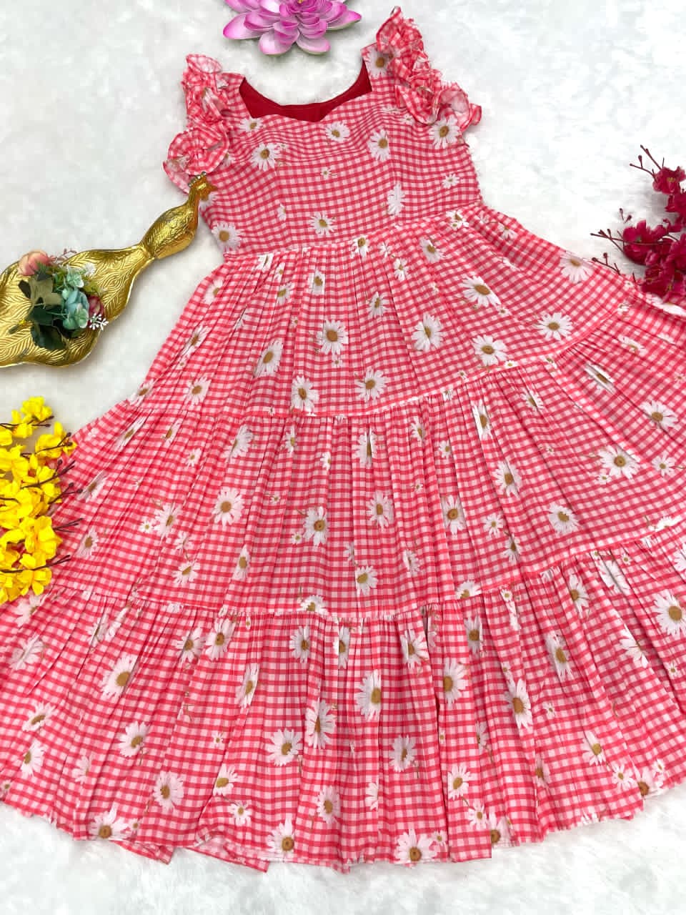 Peach checkered dress with floral pattern on a white background