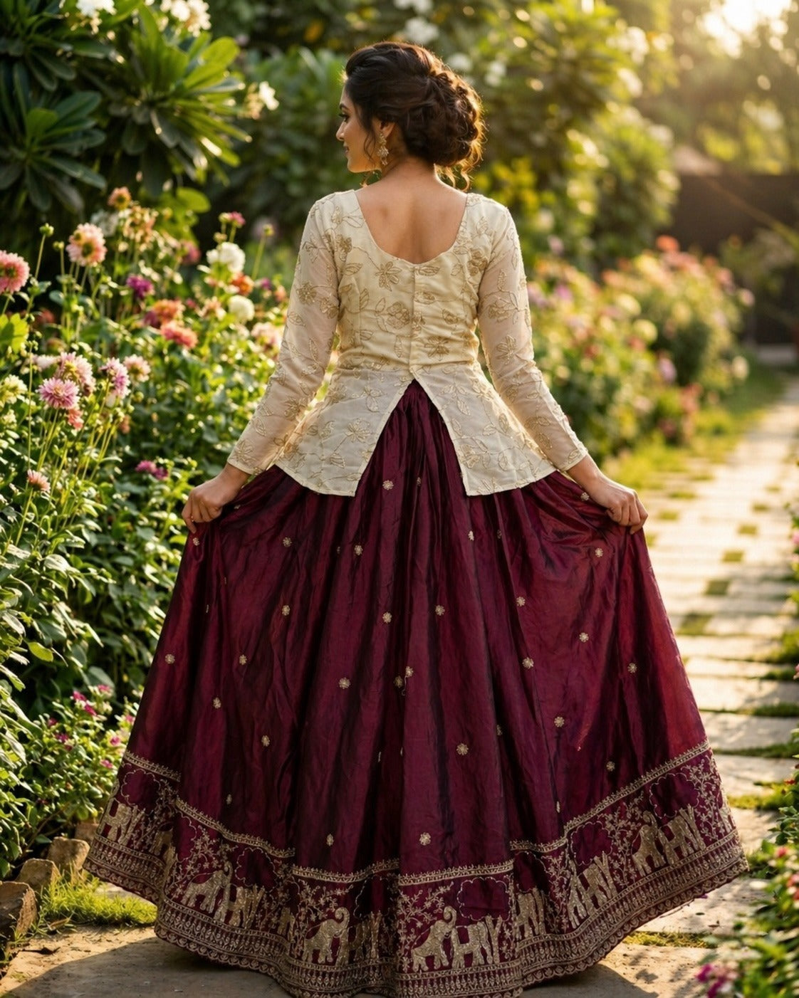 Woman in a wine traditional outfit standing in a garden with flowers and greenery.