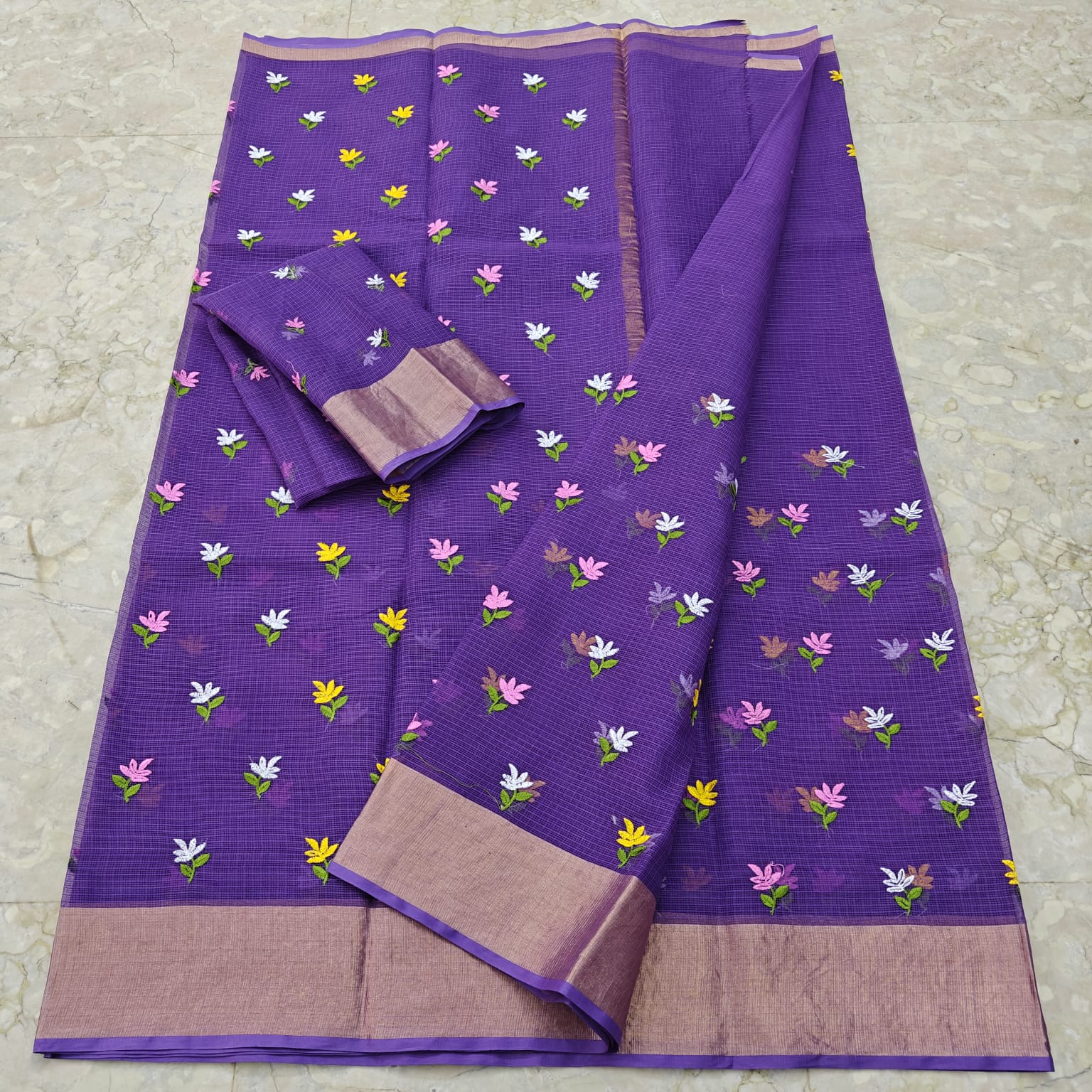 Purple saree with floral patterns