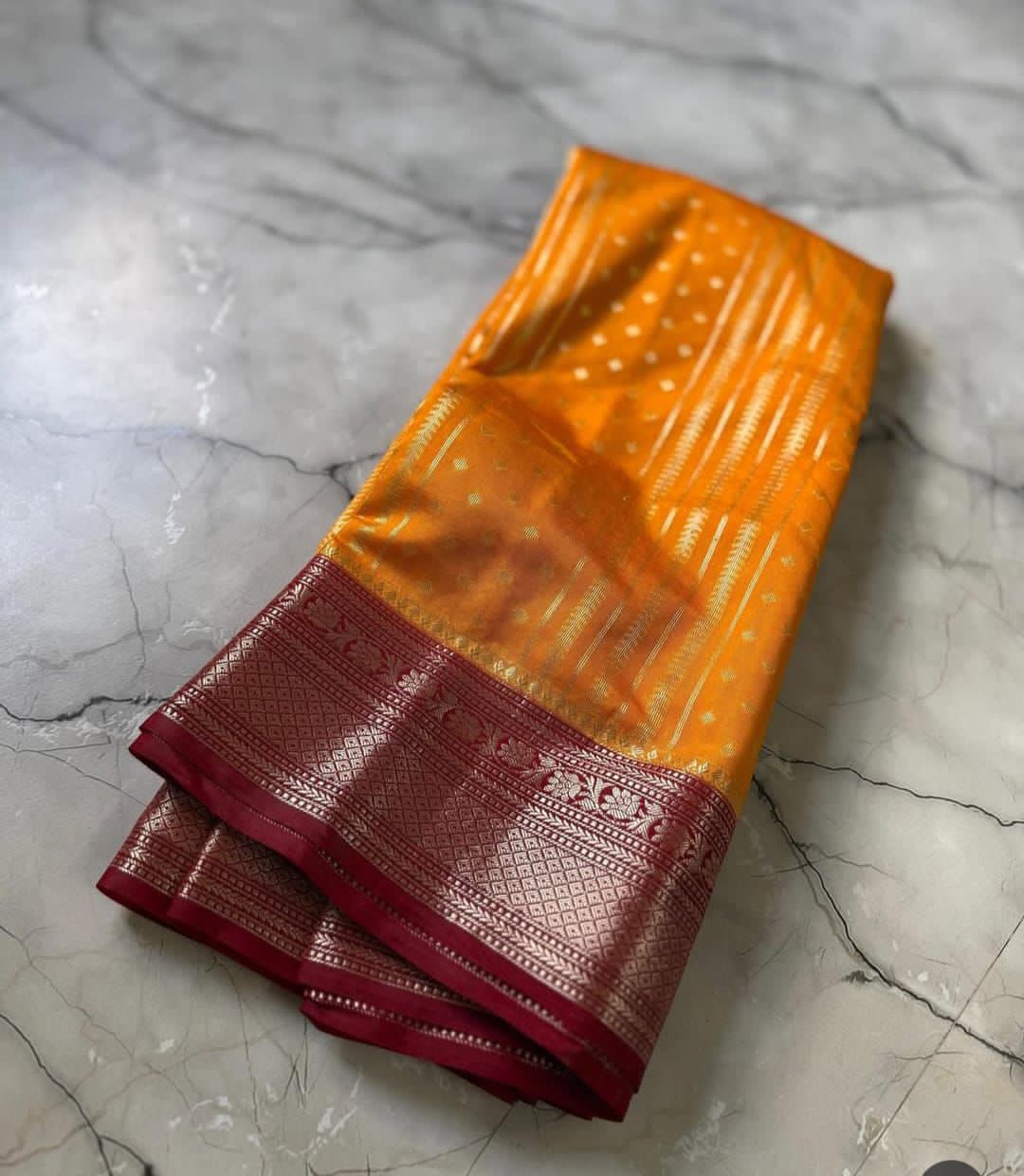 Light orange saree on a marble surface