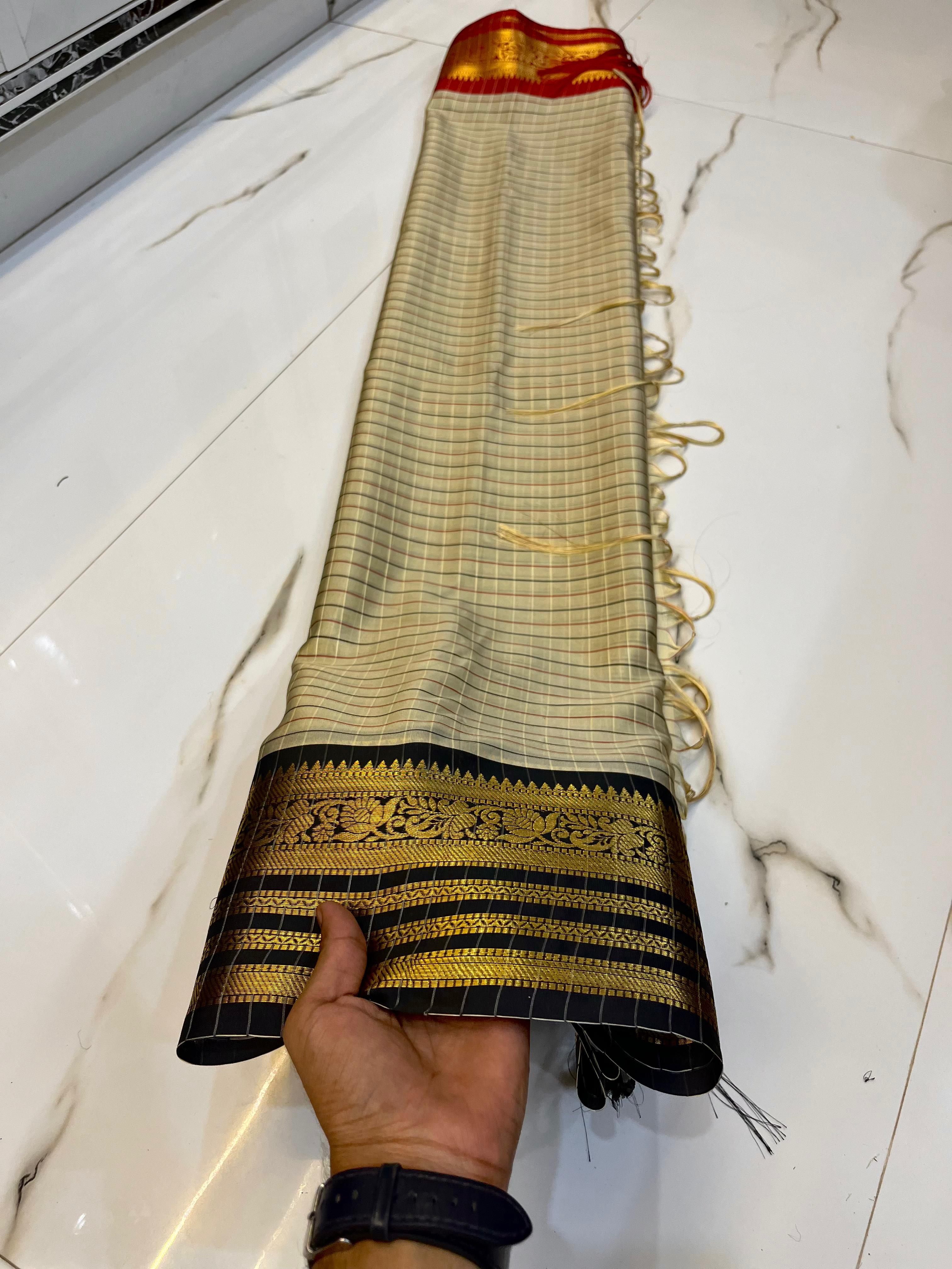 Gray Saree with gold and black and red patterns 