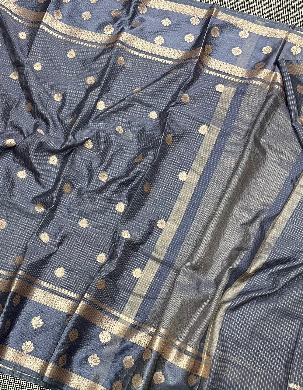 Gray fabric with gold patterns and borders