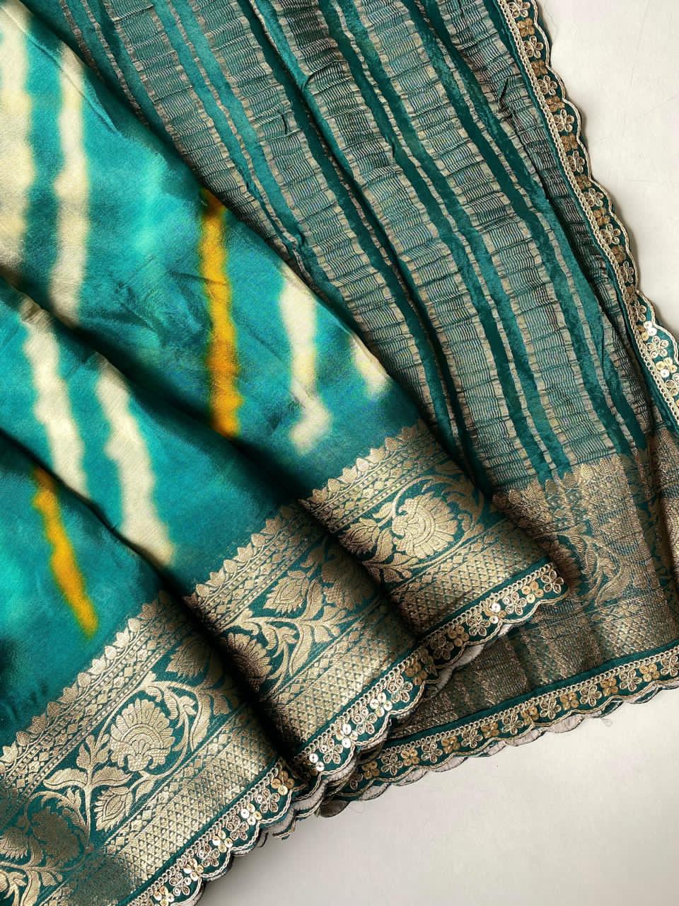 Rama green saree with patterns on a white background