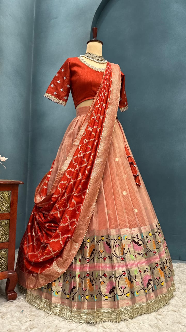 Light orange Traditional Indian saree with blouse on a mannequin against a gray background