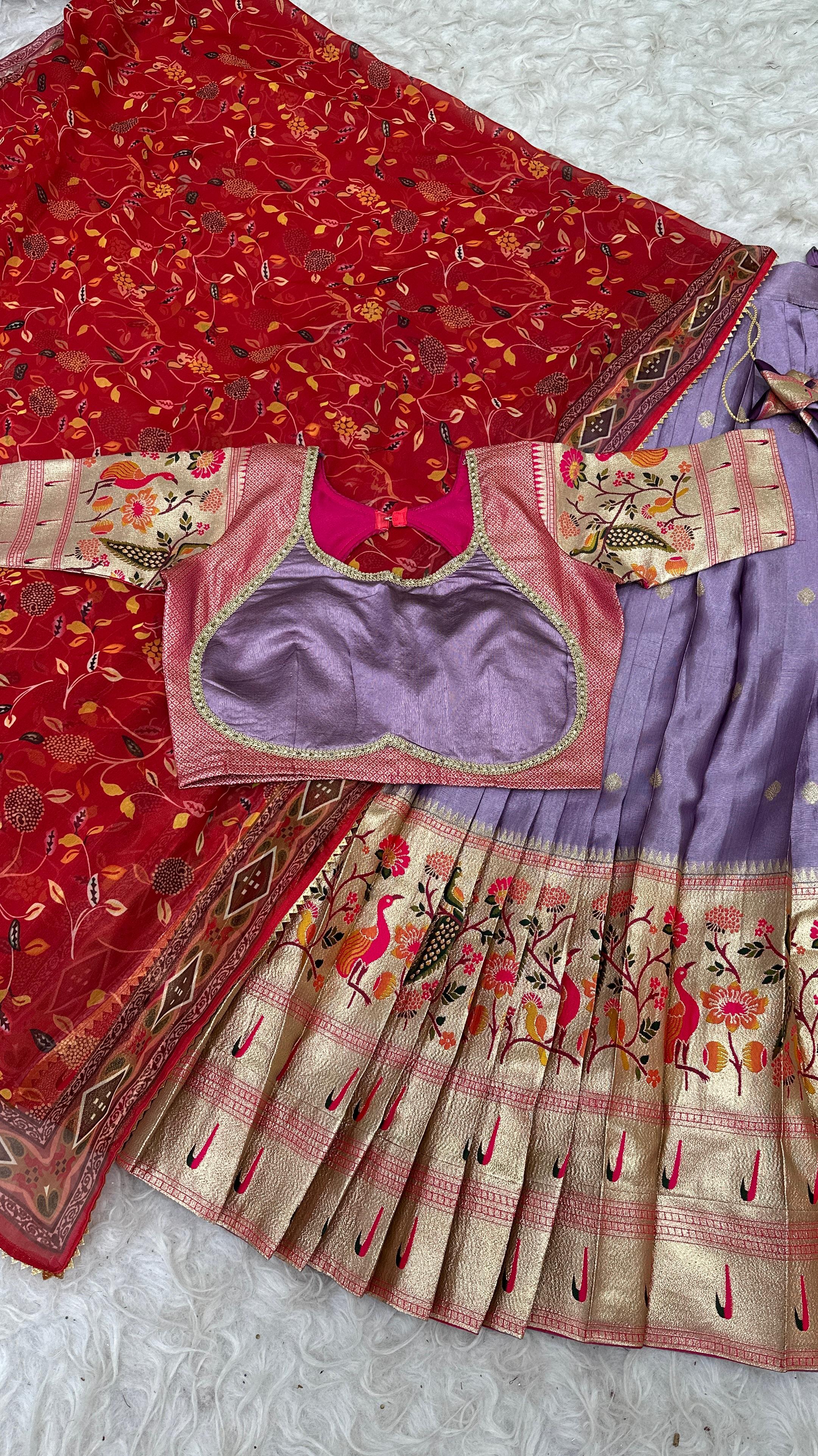 Lavender with Red Traditional Indian saree with a rblouse on a textured surface