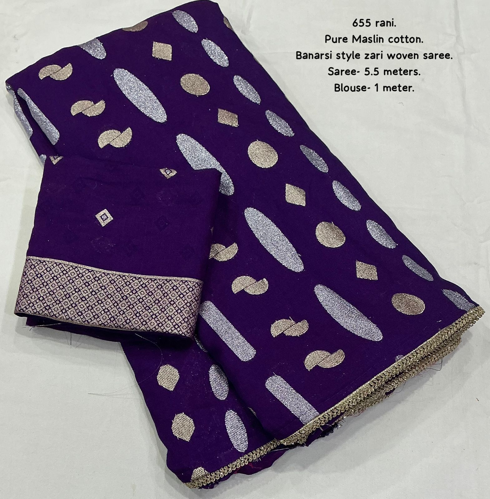 Purple saree with silver zari patterns on a white background