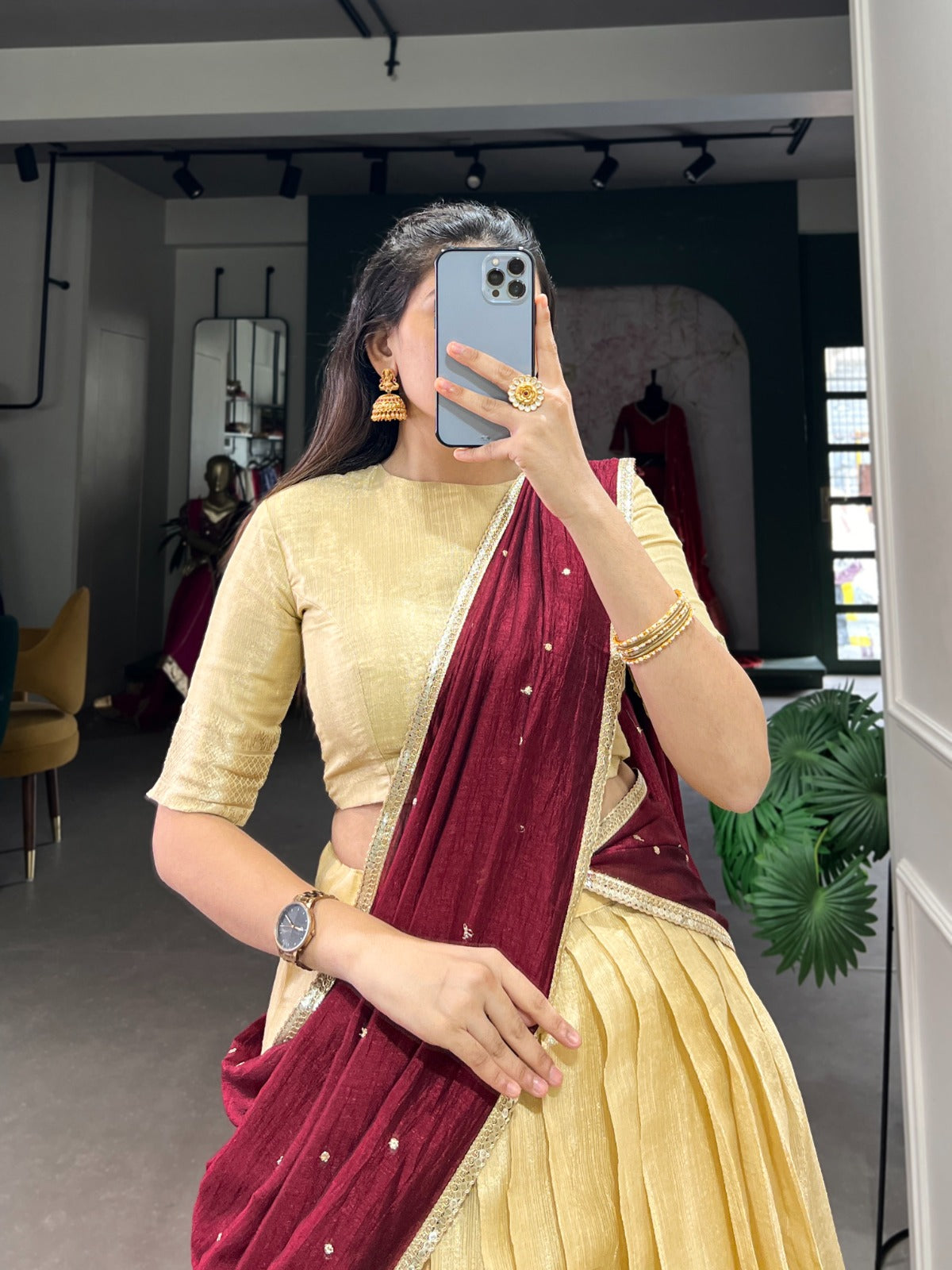 Beige colour saree with a gold blouse